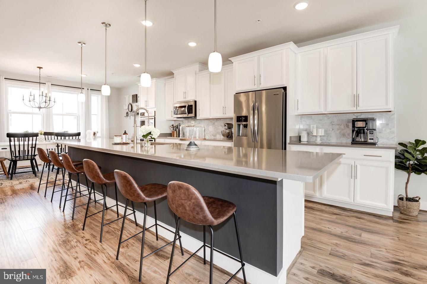 NEED A TWO HOUR NOTICE*AWESOME ONE LOUDOUN LOCATION  WITH UNIQUE ROOFTOP TERRACE*OVER 2,500 FINISHED SQUARE FEET*3 BEDROOMS, 2 FULL BATHS, 1 HALF BATH & 1 CAR GARAGE WITH ADDITIONAL STORAGE*ADDITIONAL PARKING THROUGHOUT THE COMMUNITY*OPEN, LIGHT & BRIGHT THROUGHOUT*LARGE, OPEN FLOWING FLOOR PLAN*MAIN LEVEL WITH 5 INCH WIDE PLANK FLOORING*GOURMET KITCHEN HAS BEAUTIFUL QUARTZ COUNTERTOPS, UPGRADED STAINLESS STEEL PACKAGE & 42 INCH CABINETS*EXTRA FEATURES INCLUDE BACKSPLASH & PENDANT LIGHTING*HALF BATH & EXTRA PANTRY & CLOSET*DINING ROOM WITH EXTRA WINDOWS FOR EXTRA LIGHT*LARGE OPEN FAMILY ROOM FOR VERSATILE USE*WALK OUT TO REAR DECK*PRIVATE PRIMARY BEDROOM WITH LARGE WALK IN CLOSET & DRESSING AREA*LUXURY PRIMARY BATH WITH UPGRADED QUARTZ COUNTERTOPS & FRAMELESS SHOWER*TWO ADDITIONAL BEDROOMS & 2ND FULL BATH ON UPPER LEVEL*AMAZING ROOFTOP TERRACE WITH AWESOME VIEWS*PERFECT FOR WEEKEND FUN AND ENJOYING THE ENDLESS SUNSETS*LOCATED ACROSS FROM ONE LOUDOUN CENTER-ENJOY ALL SHOPPING, RESTAURANTS, MOVIES & NIGHT LIFE*NEXT TO TOP GOLF & I-FLY FOR WEEKEND FUN*ENJOY COMMUNITY, TENNIS, PARKS & PATHS THROUGHOUT*