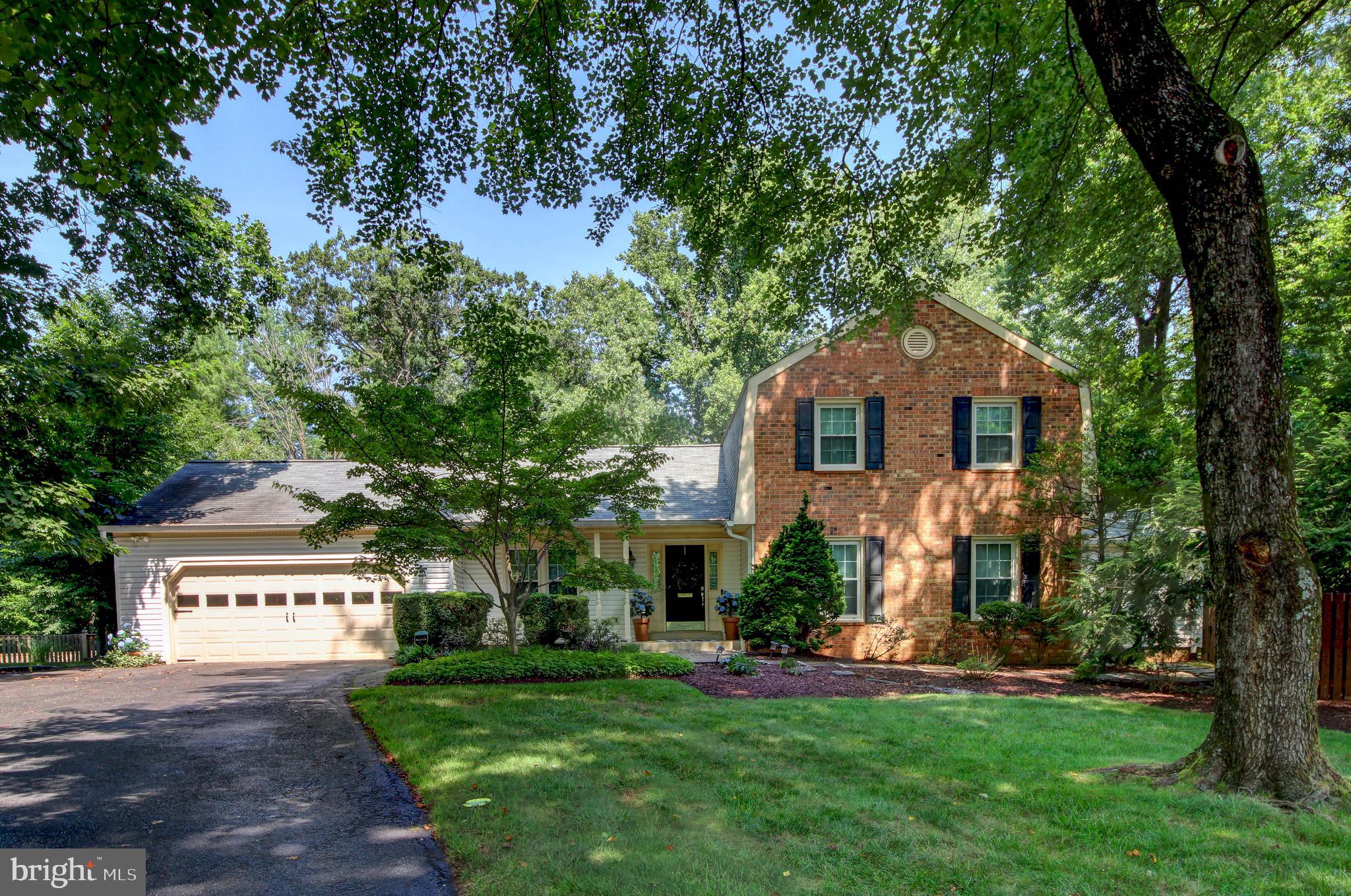 Nestled in the desirable Woodley Gardens neighborhood, this elegant, detached home at 1038 Carnation Drive offers over 4,000 square feet of interior space on a generous half acre lot. From the moment you arrive, the home's classic proportions and mature landscaping set the tone for what's inside. <br><br>

The main level opens to a welcoming foyer flanked by a living room and dining area, ideal for entertaining. The updated kitchen features beautiful wood cabinetry and solid surface counters, flowing into a breakfast nook and a spacious family room warmed by a gas fireplace. A powder room and a well-appointed laundry and mudroom combination are conveniently tucked away. Also on the main floor is a generously sized bedroom with an en-suite full bath near a second entrance, making it a flexible layout well suited to guests, an au pair, or multigenerational living. <br><br>

Upstairs, the primary suite impresses with a large walk-in closet and en-suite bath, joined by three additional bedrooms and a second full bathroom, giving the home five bedrooms in total. <br><br>

The finished lower level adds significant living space with a large family room and recreation room, both ideal for entertaining, along with a half bathroom and an oversized utility and storage room offering plenty of room to spare. A two-car garage completes the home's practical footprint. <br><br>

Outside, a deck overlooks the fully fenced, flat and incredibly spacious backyard, creating a private, park-like setting for al fresco dining or quiet mornings outdoors. <br><br>

Woodley Gardens Park sits just moments away with its tennis courts, ball fields, playgrounds, and walking trails. The Woodley Gardens Shopping Center is a short walk away, home to Carmen's Italian Ice, Z&Z Manoushe Bakery, Neighbors Coffee, Hardtimes Cafe and more. Rockville Town Center is under a mile away, offering a wider mix of restaurants, boutiques, and national retailers, and commuters will appreciate quick access to I-270 as well as the Rockville MARC and Metro station on the Red Line, a short drive from the house. For additional shopping and entertainment, Pike and Rose and Westfield Montgomery Mall are both within easy reach.