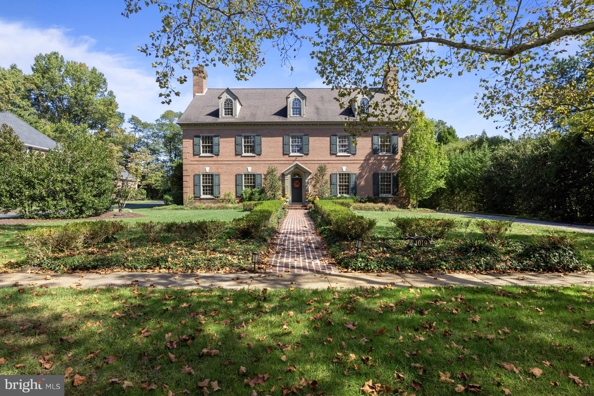 This architecturally significant Georgian Colonial residence seamlessly blends historical elegance with modern luxury. Situated on a generous and private 1.7-acre lot in one of Delaware’s most sought-after neighborhoods, this custom-built 6-bedroom, 6 full and 3 half-bath brick estate offers roughly 13,000 square feet of impeccably finished living space and built by the current owner's. Crafted in 2001 with a reverence for classical design, the home features exquisite historical elements throughout, including intricate plaster crown moldings and custom chair rails, wide-plank Santos Mahogany hardwood floors throughout, and a stately central staircase gracing the formal entry foyer. Every detail has been thoughtfully curated to honor traditional craftsmanship while delivering the utmost in contemporary comfort. The grand foyer is flanked by distinguished formal living and dining rooms, each with its own fireplace—wood-burning and gas, respectively. The dining room connects to a well-appointed butler’s pantry, leading into a chef’s kitchen designed for both beauty and function. Highlights include Knudsen custom cabinetry, antique panel glass details, a hand-made burled walnut island with seating, and premium appliances—including dual dishwashers. Adjacent to the kitchen is a private office/study with a wood gas-burning fireplace and a discreet staircase leading to a spacious HVAC controlled media room located above the three-car garage. The expansive family room offers built-in shelving, a wood-burning fireplace, and direct access to the rear slate patio—perfect for entertaining or quiet enjoyment. Additional main-level features include formal and informal powder rooms, a large laundry room, and convenient interior access to the garage. Ascend the elegant main staircase to the luxurious primary suite, which boasts a generous bedroom, spa-like en-suite bath with jetted soaking tub, walk-in shower, cultured marble double vanity, and custom-designed California Closets. The second level also offers an additional en-suite bedroom and two more bedrooms connected by a Jack-and-Jill bath. The third floor features two additional bedroom suites, a comfortable sitting room area, and a large storage room—ideal for needed overflow storage. The finished lower level is designed for entertaining on a grand scale. It includes a custom speakeasy-style bar with wine room, a media room, full bathroom and powder room, dedicated office space, and abundant storage. Step outside to the private rear yard and enjoy the beautifully landscaped slate patio, in-ground pool, and expansive, newly fenced lawn—perfect for recreation or relaxation. This extraordinary Greenville property offers unparalleled privacy and elegance, all within minutes of Downtown Wilmington, Rockford Park, Trolley Square, Amtrak, and major roadways.