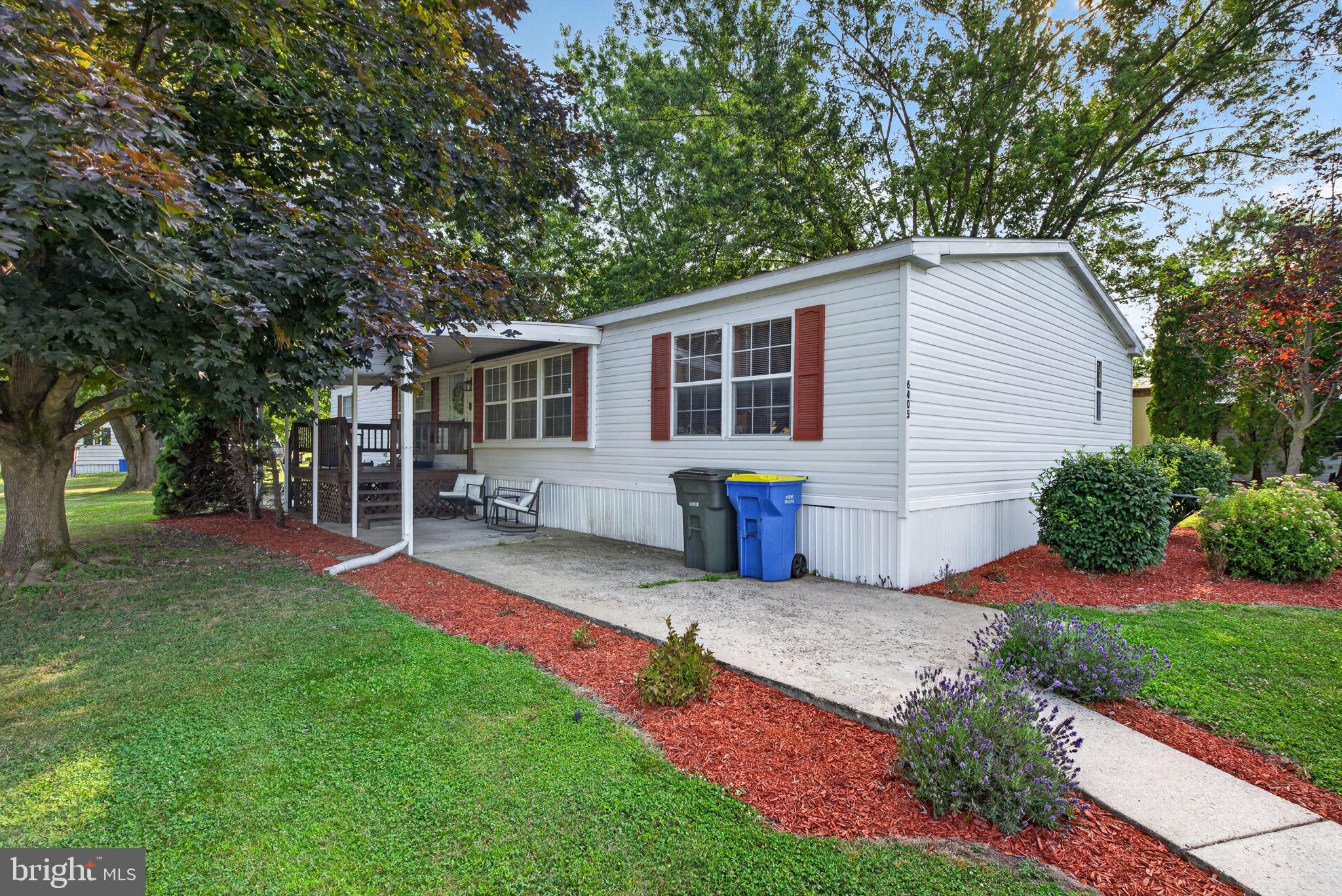 Welcome to 6405 Dupont Ave. Dover PA, a mobile home offering a comfortable and functional layout. Relax on the covered front deck, the perfect spot to enjoy your morning coffee or unwind at the end of the day. Step inside to a spacious living room featuring a cozy fireplace that creates a warm and inviting atmosphere. The modern kitchen is designed for everyday living with a center island that provides additional prep space. There is a primary BR with an en-suite bathroom that connects directly to a spacious walk-in closet. Two additional bedrooms provide plenty of space for family, guests, or a home office, while a second full bathroom and a dedicated laundry room add to the home’s practicality. With its thoughtful floor plan and inviting living spaces, this home is ready for its next owner. Keep cool with central air conditioning. Lot rent is $645 per month. Schedule your showing today!