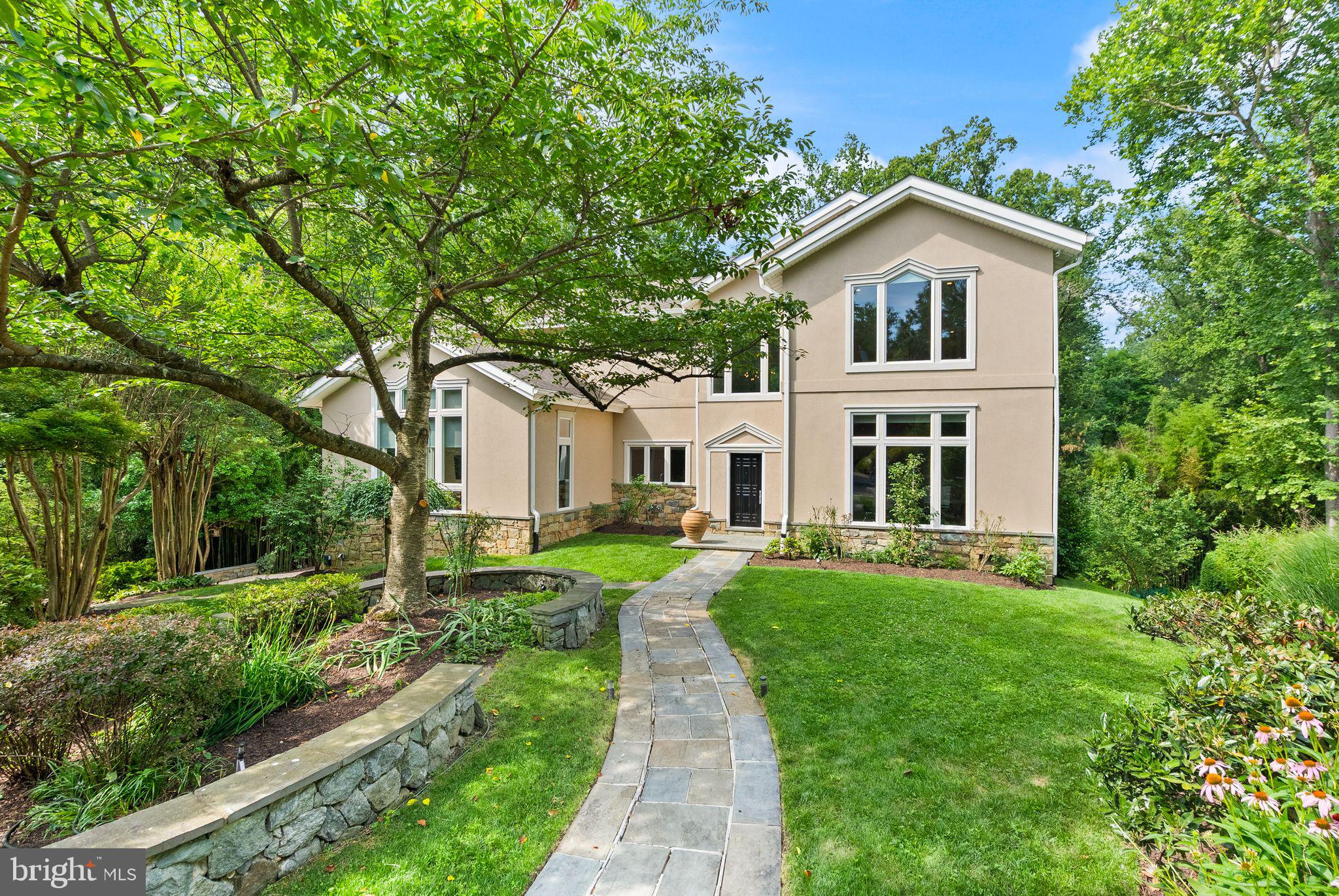 Experience unparalleled sophistication in this contemporary European-inspired Bellevue Forest estate, gracefully perched on a rare half-acre+ lot. Masterfully reimagined by acclaimed DC architect Travis Price, this nearly 7,000 sq.ft. residence is bathed in natural light through expansive floor-to-ceiling windows, skylights, and interior glass walls, seamlessly blending modern elegance with serene natural surroundings.

The home’s six bedrooms, four full bathrooms, and two half baths are thoughtfully arranged across three levels, each designed for comfort and tranquility. A dramatic grand foyer sets the tone, inviting you into a world of refined design and impeccable craftsmanship. The primary suite is a private sanctuary, complete with a spa-like bath, a quiet kitchenette, a balcony overlooking the lush landscape, and an expansive walk-in closet with custom built-ins.

At the heart of the home, the chef’s kitchen is a masterpiece, adorned with imported Italian natural stone countertops and Gessi fixtures, reflecting the same level of artistry throughout the home. Indulge in ultimate relaxation with a dedicated indoor spa featuring a Jacuzzi hot tub, while custom glass stair railings, a fully integrated Smart System, indoor and outdoor Yamaha sound, and a Crimpco security system with multiple cameras enhance both comfort and peace of mind. Outside, extensive hardscaping and a private backyard showcase a custom-built studio/playhouse, creating a perfect retreat for entertaining or quiet reflection.

Ideally located within a mile of Washington Golf and Tennis Club, Gulf Branch Nature Center, Potomac Heritage Trail, and a wealth of parks, this home offers easy access to Arlington’s premier shops, dining, and top-rated schools, including Jamestown ES, Williamsburg MS, and Yorktown HS. This exceptional property invites you to experience the rare combination of exclusivity, elegance, and contemporary comfort.