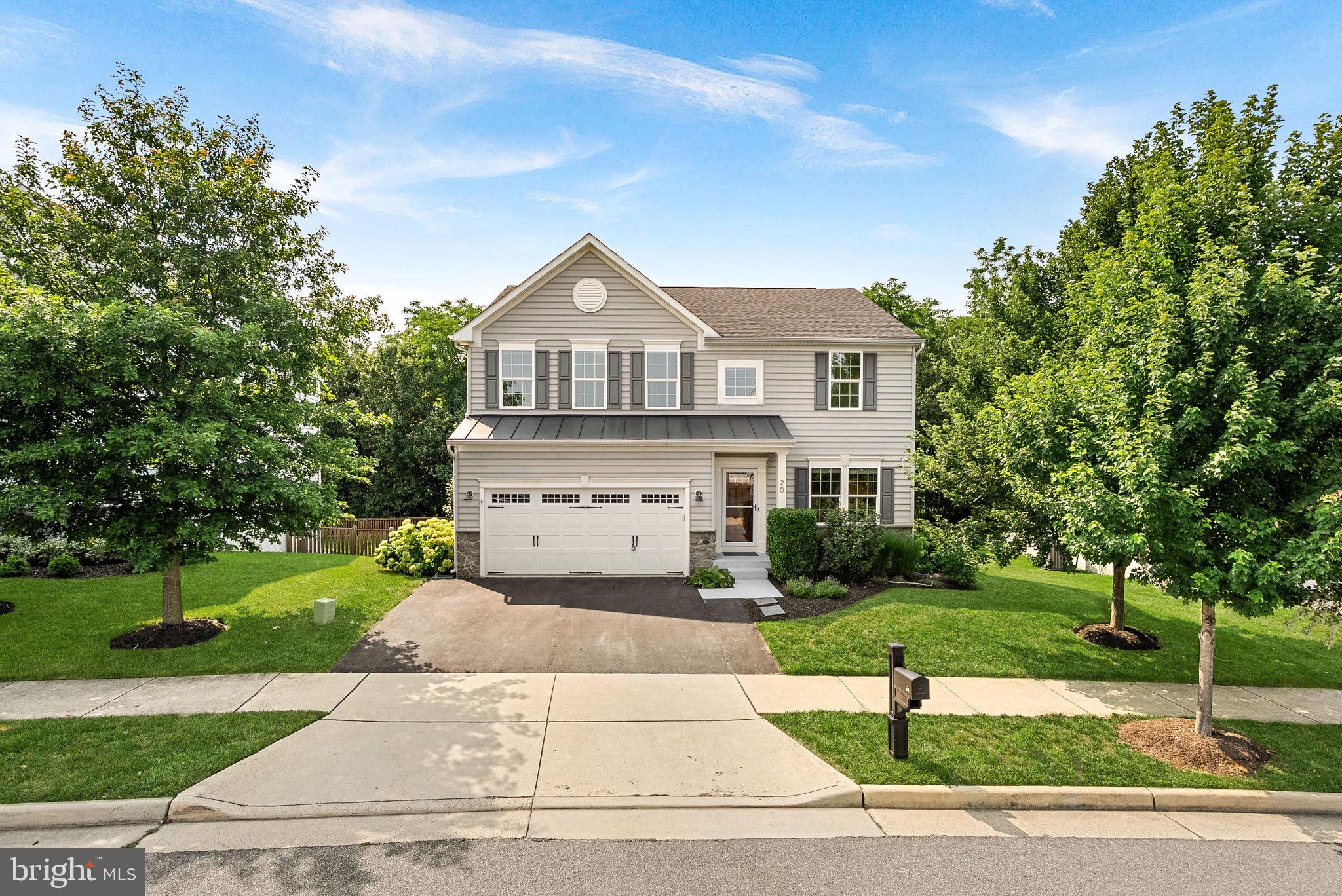 Welcome to this beautifully maintained home in the heart of Lovettsville Town Center, where small town charm meets everyday convenience. Set on a private lot backing to mature woods, this 4 bedroom, 3.5 bath home offers a functional floor plan, thoughtful updates, and the perfect balance of privacy and neighborhood living.

Upstairs you'll find all four bedrooms, two full bathrooms, and a spacious laundry room. The main level is designed for the way people actually live, with a living room, family room, kitchen, breakfast area, and a convenient mudroom just off the garage. The kitchen offers ample cabinet and counter space, while hardwood floors and recessed lighting add warmth throughout the main level.

One of the highlights of the home is the beautiful screened porch, added in 2021, where you can relax while enjoying peaceful wooded views and frequent visits from local wildlife. The finished lower level features a large recreation room, an updated full bathroom (2021), and an oversized storage room. Be sure to look for the fun hidden room tucked behind the bookcase under the stairs!

Recent updates include fresh paint (2026), brand new upstairs carpet (2026), a washer and dryer (2025), dishwasher (2024), and ceiling fans in every bedroom.

Living here is about more than just the home. Lovettsville offers the kind of small town community that's becoming harder to find. Walk to local restaurants, the coffee shop, the tot lot one block over, and the Town Green, where you'll enjoy community favorites like Mayfest, Oktoberfest, Movies on the Green, concerts, holiday celebrations, and more throughout the year.

If you've been looking for a home that offers privacy, a practical layout, modern updates, and a true sense of community, this one is not to be missed.