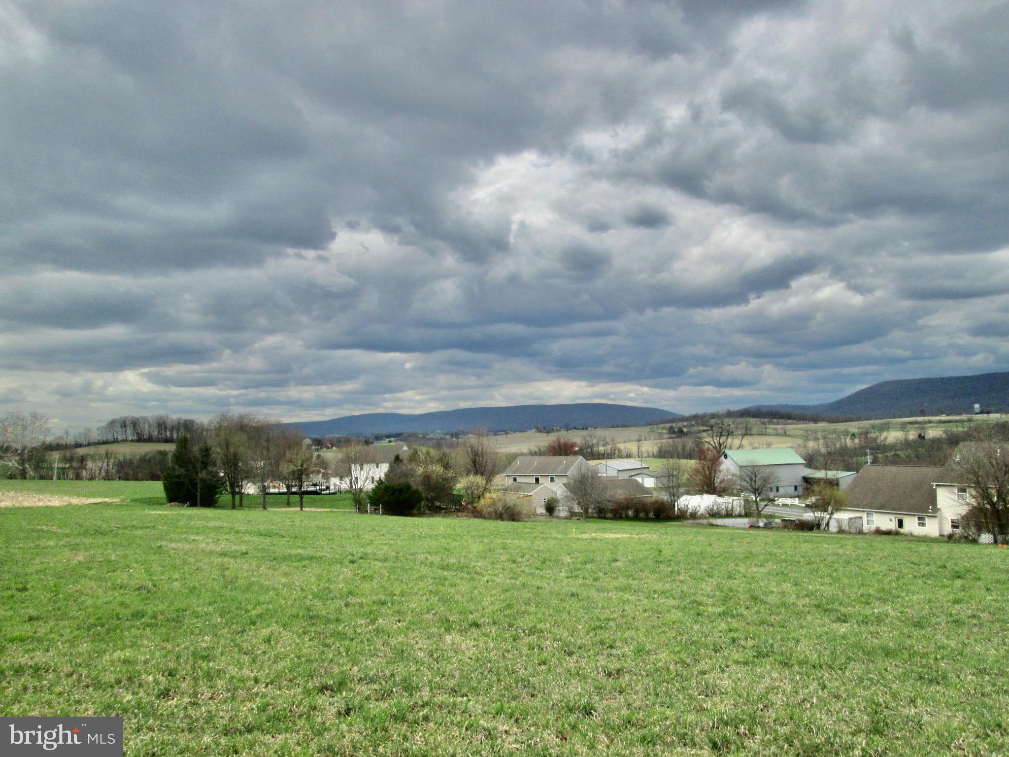 Build your dream home on this beautiful 3.25-acre parcel! This perc-approved lot offers the perfect blend of privacy and breathtaking scenery. As you travel up the hill, the property opens to a spacious, level 2-acre area—ideal for building—featuring panoramic views of the valley and distant mountains. Bring your own builder and design the home you’ve always envisioned in this peaceful, picturesque setting.