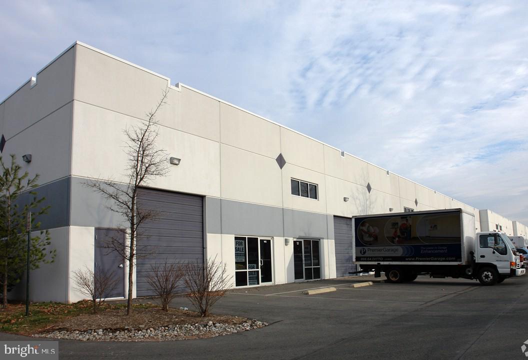 10' wide drive-in door, open warehouse with racking,  270 SF office, and bathroom.