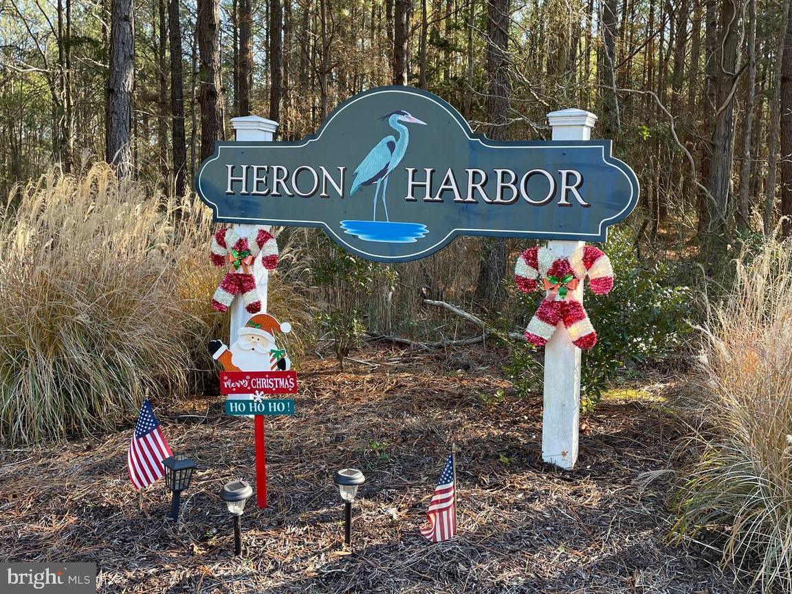 Nice buildable lot in the water privileged Heron Harbor.  This private lot is the perfect place to build your new home. Within walking distance to the community dock and natural beauty of Fishing Creek. This one will not last long!!