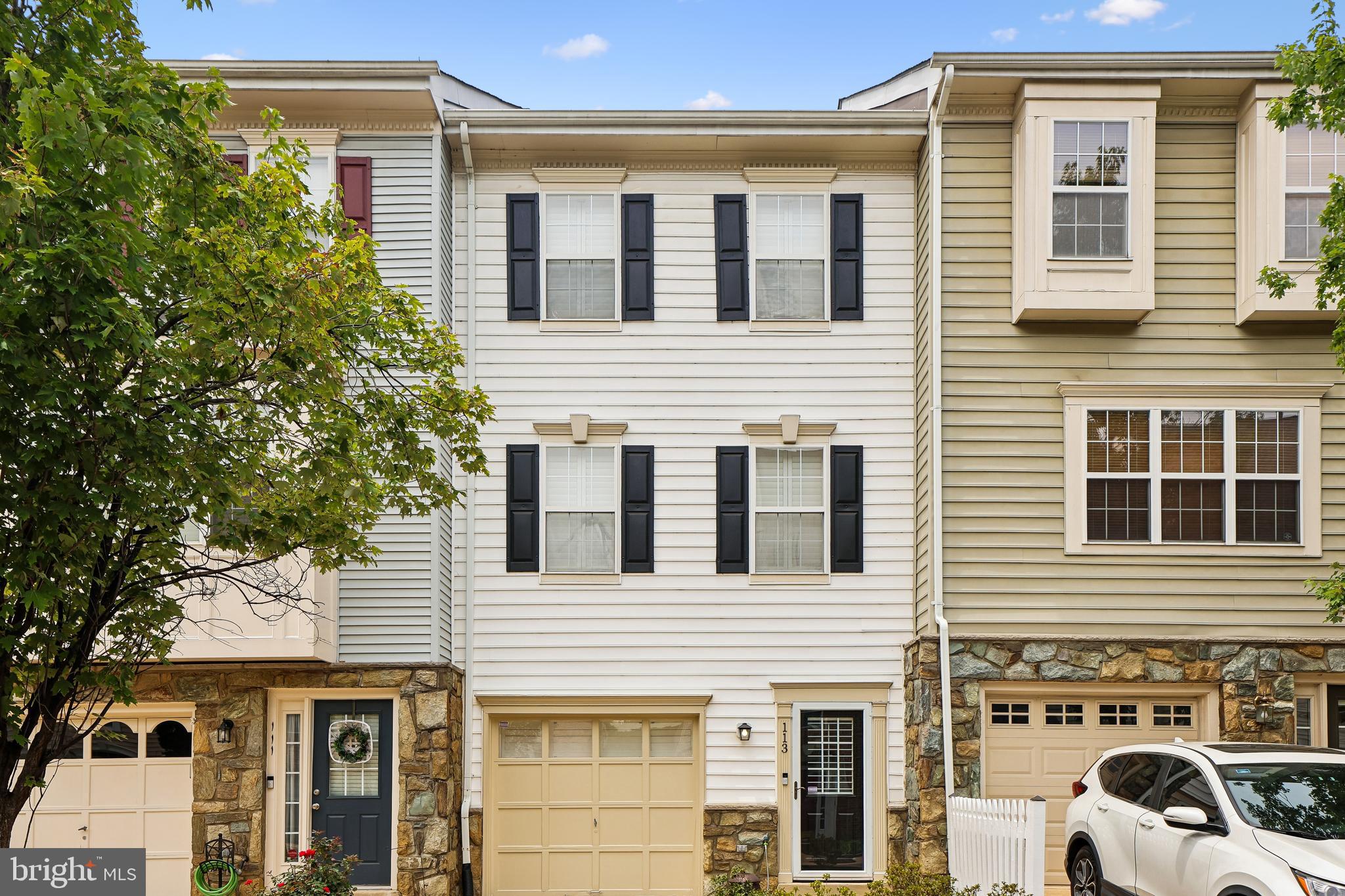 113 Meadows Lane offers a thoughtfully updated, four-level townhome in Alexandria with 3-4 bedrooms, 3.5 bathrooms, flexible living spaces, and extensive recent improvements.  The main level centers on a renovated kitchen designed for both cooking and entertaining. Features include granite countertops, coordinating backsplash, crown and picture molding, chair railing, recessed and updated pendant lighting, and an island with additional cabinet storage and granite surface. The kitchen is equipped with white cabinets.  Stainless appliances include a:  Kenmore Microwave (2021), Kenmore Dishwasher (2021), Samsung Range (2026), and a 2026 Frigidaire Refrigerator with an Icemaker.  The Garbage Disposal was new in 2025.  New shelving in the pantry enhances storage. Professionally painted in 2026, this level also showcases refinished hardwood flooring and a new sliding glass door (2026) opening to a large deck, ideal for outdoor dining and relaxation. Plantation shutters add a polished finish.  The adjacent dining room offers refinished hardwood flooring (2026), plantation shutters, crown molding, chair railing, and picture molding, creating a defined space for formal or casual meals. The living room continues the cohesive design with 2026 refinished hardwoods, recessed lighting, an electric wall fireplace, plantation shutters, crown molding, and picture molding.  A main-level powder room, updated in 2025-2026, features a granite countertop, crown molding, new vanity, toilet, wall cabinet, fixtures, and refinished hardwood flooring.  On Upper Level 1, the primary bedroom includes hardwood flooring, plantation shutters, an electric wall fireplace (2025), and a walk-in closet with built-ins. The primary bath offers ceramic tile, a jetted whirlpool tub/shower, crown molding, and updated fixtures including lighting, mirror, towel rack, and toilet paper holder (2025). The second bedroom also has hardwood flooring, plantation shutters, and built-ins in the walk-in closet. The second full bath features ceramic tile, a jetted tub/shower, granite countertop, and new lighting fixtures.  Upper Level 2 provides a versatile bedroom/office with hardwood flooring, plantation shutters, a stand-alone air conditioner/heater (2001), a built-in wall safe, and a closet with built-in shelving and hanging rod. This level is well suited for a home office, guest space, or studio.  The lower level expands the living area with a converted garage space that now serves as an additional living area. It includes hardwood flooring, an electric wall fireplace (2025), crown molding, plantation shutters, a closet, and French doors separating the living area from an office/bedroom space. The bedroom/office area features hardwood flooring and a French door with plantation shutters leading to the patio. The lower-level bathroom offers a shower, new pedestal sink, hardwood flooring, and crown molding. A separate laundry room houses a full-size stackable Kenmore washer and dryer (2018).  The hallway entrance is finished with crown molding, chair railing, and picture molding, reinforcing the home's consistent trim detail. Outdoor living is enhanced by a fully fenced patio with pavers covering the ground, stairs to the large main-level deck painted in 2026, and a French door with plantation shutters leading inside.  Updates include: water heater (2020), HVAC (2016), and roof (2017).The quarterly HOA fee is  $384.45/quarter.  School buses pick up INSIDE the neighborhood.  Van Dorn and Eisenhower Metro Stations are within two miles. It's three miles to  Old Town Alexandria, and is easy access to 495/95, 395, 295, Washington DC, and the Pentagon.  A 2.5 mile recreation trail runs along Eisenhower Avenue and the Cameron Run Regional Park which offers mini-golf, a waterpark, and outdoor batting cages.  Please attend the Open Houses on July 11 and 12 from 11am - 1 p.m. Stop by for snacks and an opportunity to win a $50 Amazon Gift Card.