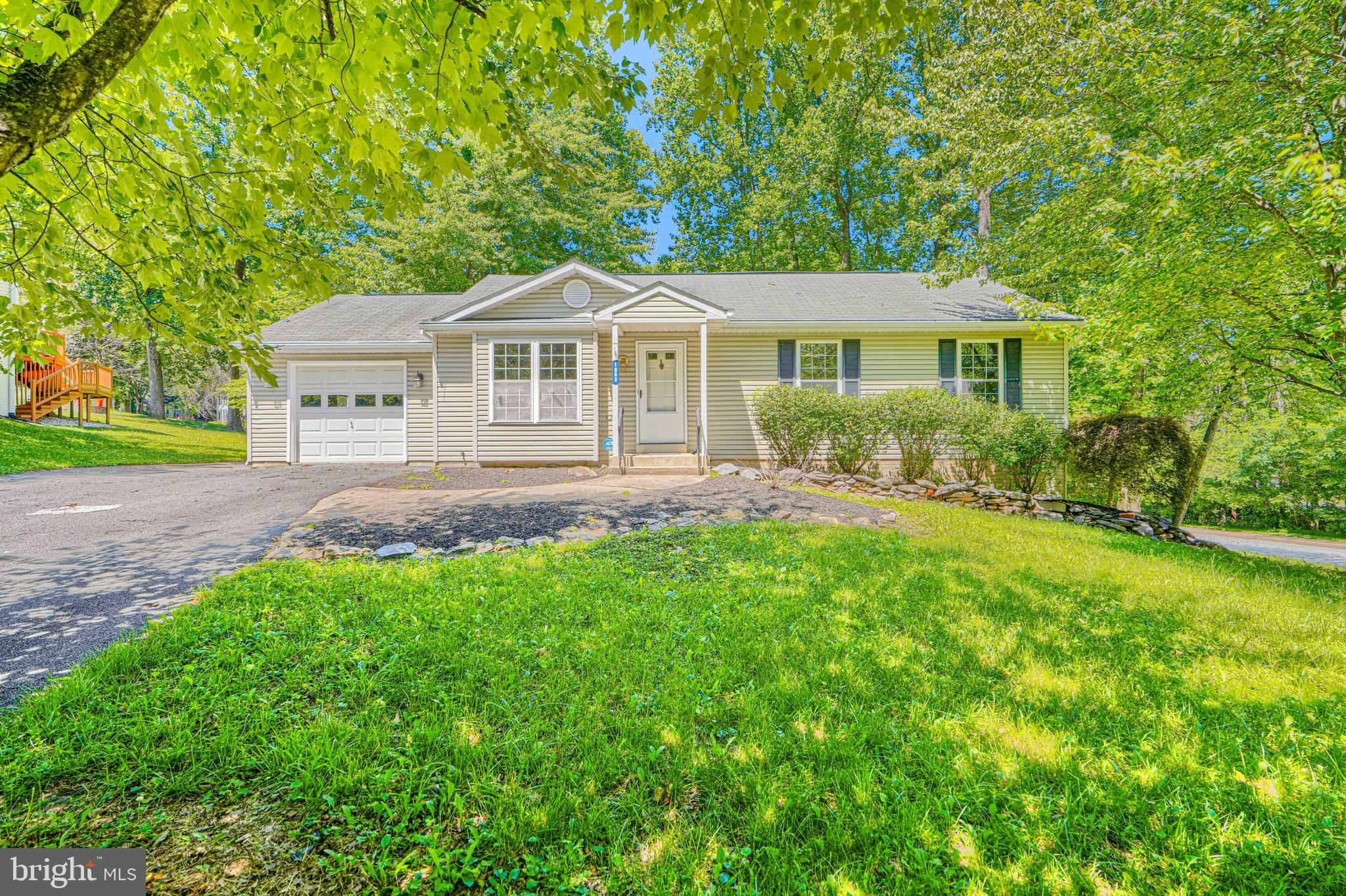 3Bd/2,5Ba rancher.  Vinyl siding, asphalt single roof, 1 car attached garage and covered rear deck.Freshly painted throughout. First floor has a livingrm with electric frpl, eat in kitchen, 2Bd and 1.5 baths.  Finished lower level with 3rd bedroom, full bath, possible office and family room. Conv. to shopping and Rt 70