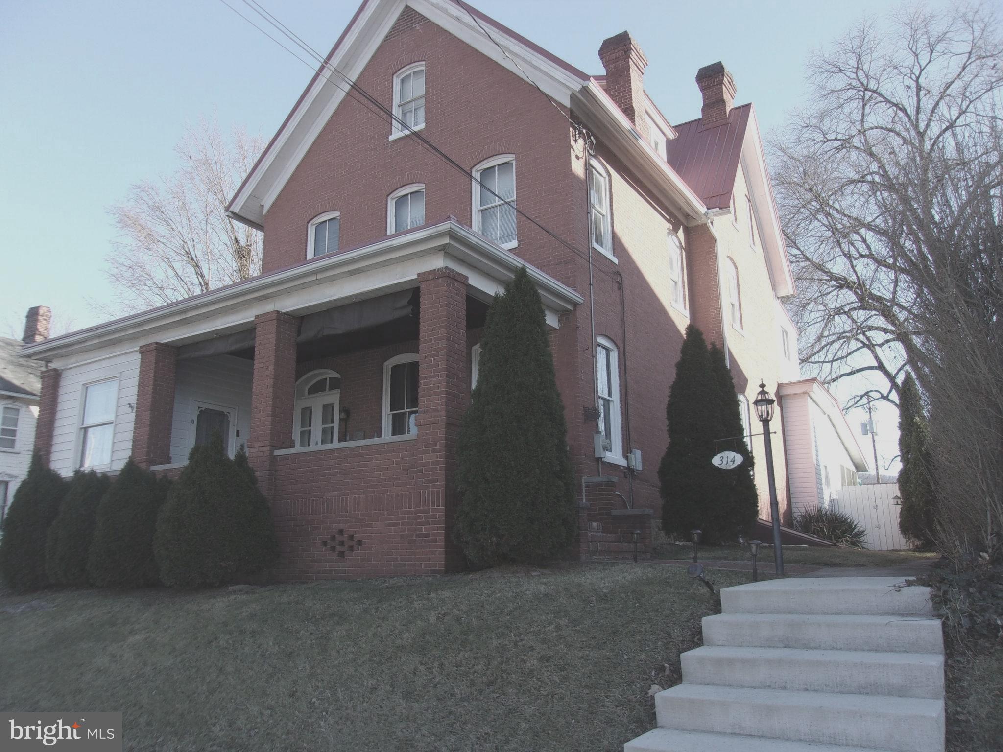 Charming 1873 Brick Home in the Historic District on a Half-Acre Lot. Nestled in the heart of picturesque Bedford Borough, this stunning home offers a rare opportunity to own a piece of history while enjoying modern comforts. The property exudes character with its original architectural details, including a classic facade that harks back to a bygone era. Rich in historic charm, the home showcases all original oak hardwood floors, beautifully preserved woodwork, and an elegant staircase in superb condition. Three ornate soapstone fireplaces add warmth and character throughout the home. Spacious and inviting, the home features multiple bedrooms, 3.5 baths, and a generous living area that offers exceptional flexibility for large families, guests, or creative living arrangements. The bathrooms have been thoughtfully updated, blending modern convenience with timeless architectural details. The kitchen is wonderfully modern, featuring stainless steel appliances and an island with a custom made wooden countertop. The home boasts high ceilings, thick brick walls that help retain heat, and generously sized rooms that reflex the craftmanship of the era. Every corner highlights the beauty of its historic construction. Situated on a half acre lot, the property provides abundant outdoor space with endless possibilities - gardens, entertaining areas, maybe a pool. With its size and layout, the home is well suited for multi-generational living or a variety of residential uses. Located within walking distance to local shops, dining, and cultural attractions, this home not only offers a unique living experience but also places you at the center of a vibrant community, rich in history and charm. Don't miss the chance to own a piece of Bedford Borough's legacy.