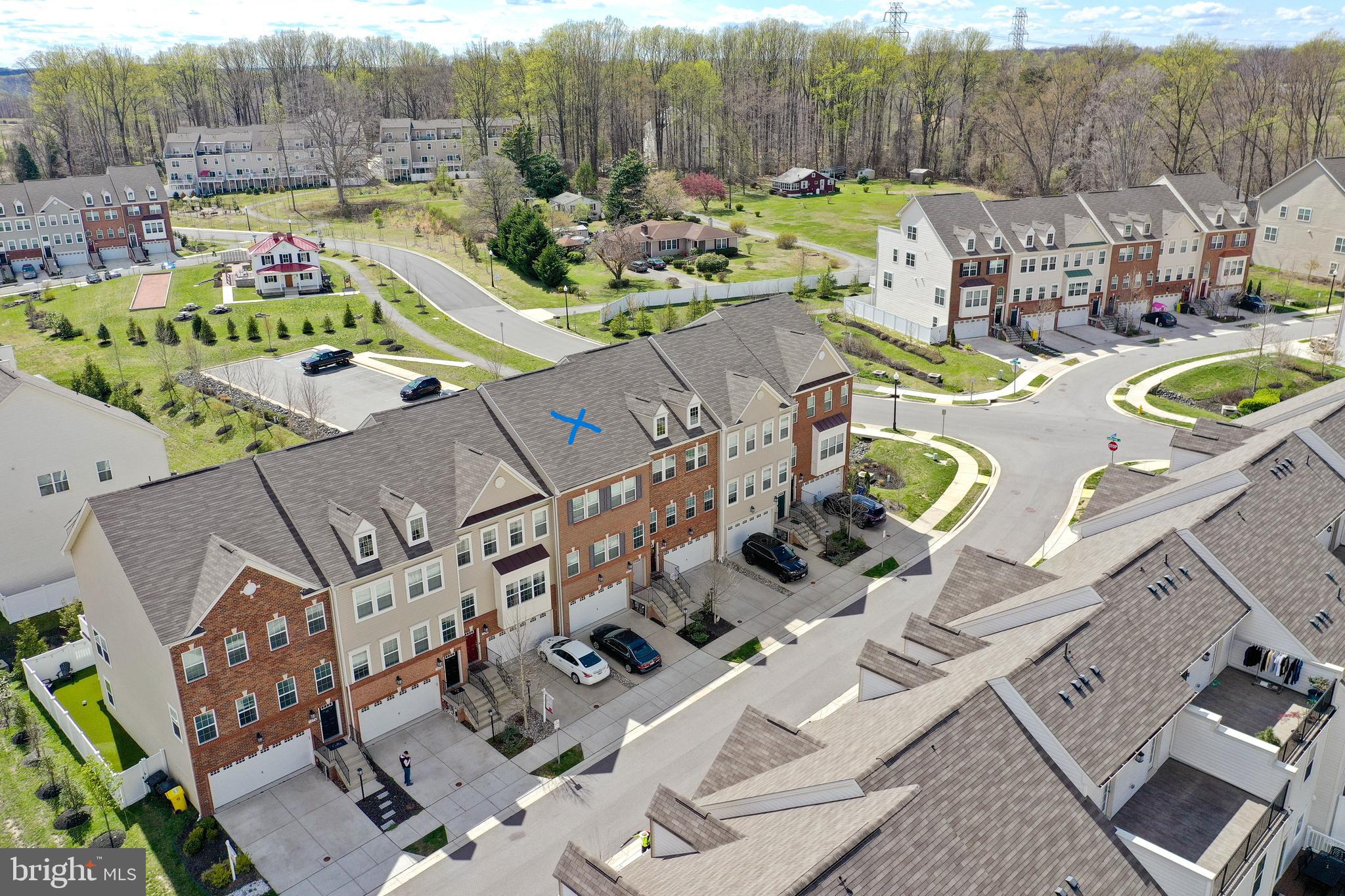 Beautiful 3 Level 2 Car Garage Townhouse in the sought area of Gambrills in the community of Summerfield Village, 2,772 Total Sq Ft per tax records. This home has had only one owner and is less than 6 years old and very well maintained. You will love the Open-Concept Main Level that features amazing Knotted Chestnut Mohawk Wood Flooring in the Family Room, Dining Area and Upgraded Gourmet Kitchen w/ Elegant Dallas White Granite Countertops, Electrolux Stainless Steal Appliances, 5 Burner Gas Cooktop w/ Vented Hood to Exterior, Over-Sized Walk-In Pantry, Wall Oven, Granite Island w/ Storage and Power to plug in your Crockpot/Instant Pot or Griddle in the Morning. The Kitchen also boost plenty of Storage w/ Sleek Stone Color Cabinets, Recessed Lighting, plus Breakfast Bar w/ Pendant Lighting and Stools Seating. Just off the Kitchen and Pantry is a Coffee Bar w/ Wine Rack, Half Bath w/ Pedestal Sink and a Slider to a Large Composite Deck.  The Upper Level includes 3 bedrooms, 2 Full Bathrooms and your Laundry Closet all on the same Level, no need to carry laundry baskets up and down the stairs, huge bonus!! The Primary Bedroom has an En-Suite, Plenty of Natural Light w/ 3 Windows, Large Walk-In Closet w/ Window and Crown Molding. The Primary Bath includes; Granite Counter Top w/ Double Sinks, Ceramic Tile Flooring, Water Closet and Shower Stall w/ Tile Surround. The Hallway Full Bath has a Shower/Tub Combination w/ Tile Surround & Flooring. The Lower Level has a Rec Room w/ Full Bathroom w/ Shower, Granite Countertop and Tile Flooring. The Rec Room is fully Carpeted and has a Slider to the Backyard w/ an area of Grass for that new Puppy or household Pet.  Additional Items to Mention, the Garage has a Storage Closet, Driveway Fits 2 Cars, Entry Foyers Main and Garage has the same Knotted Chestnut Mohawk Wood Flooring as the Main Level, Heating/AC w/ Smart Thermostat and 2 Coat Closets One Main Level the Other near Garage Entry. This home is conveniently located w/ a pathway to Waugh Chapel Towne Centre which includes Restaurants, Cafes, Shopping options including Boutiques as well as a Large Retail Stores, Movie Theater, Banks, Grocery Stores, Wine Bar, Pubs a Gym and much more... The location is idea for commuting to Annapolis, DC, Baltimore, Fort Meade and NSA. The Community Amenities Include, Community Clubhouse, Dog Park, Jog/Walk Paths and Tot Lots/Playgrounds. Looking for a very well maintained and loved home that is move-in ready this is the one, schedule your Appt ASAP, this one will go quickly.