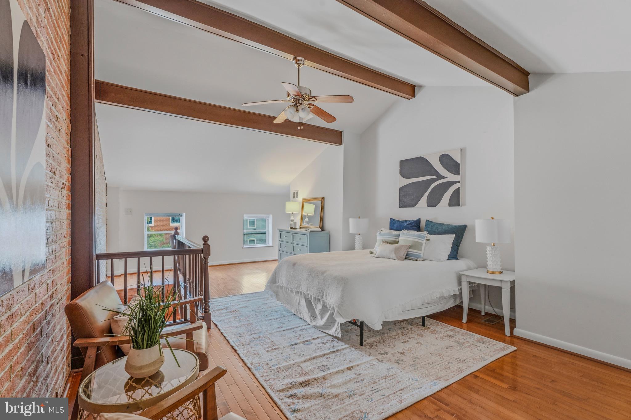 You will want to check out this townhome centrally located west of Patterson Park and north of Fells Point.  This location allows for great walkability to area restaurants and businesses.  This home has had many updates and upgrades but retains historic charm with exposed brick and wood beams throughout the home. 
Main level has hardwood flooring in the open Living Room and Dining room area.  Kitchen has wood cabinets, stainless appliances, and granite countertops.  There is also a main level full bathroom and Laundry room.  Heading upstairs to the 2nd level, you'll see the hardwoods carried throughout the hallway and bedrooms.  There are two bedrooms and a 2nd full bath on this level.  Another staircase takes you to the 3rd story Primary Bedroom suite that is spacious enough for a sitting room area.  With its exposed beams and brick, this area creates a private retreat.  The home has a fenced backyard with Patio and back alley access to the side street.  There is plenty of storage in the Basement too.  Act quickly!  This one won't last!!!