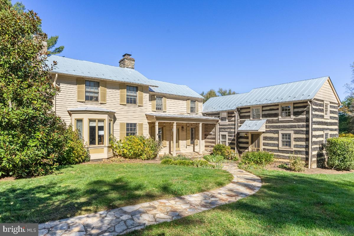 The charming and tranquil country home of Chailey  is an 18th century log and clapboard home which through the years has been restored and expanded. Set behind a picket fence, the home and lawn is graced with low stone walls and wonderfully planted perennial gardens and trees. In the 1980's this was the personal retreat for the prominent interior designer Samuel Morrow, which he beautifully transformed and was featured in Southern Accents Magazine in 1986. 

This home gracefully blends with its surroundings with rooms opening to views, and terraces. As one enters into the living room (18' x 14’10”), the juxtaposition from the old to the new is stunning.  The living room with exposed log walls, heart pine flooring and handsome stone fireplace w/ 8’ hearth is open to the sunroom (16’ x 12’). From the sunroom one can enjoy Blue Ridge Mountain views, garden views and access the stone terrace and gardens. To the left of the living room is the library (17’10” x 14’) with built in bookcases, walk in bay windows and a powder room. Between the living room and library, a stairway leads to the second and third en-suite bedrooms. 

To the right of the living room is the gourmet kitchen (15’6 x 12’6") with dove tail cabinetry, granite countertops, Sub Zero refrigerator and separate freezer drawers, 5 burner gas Thermador cooktop, 3 under counter ovens including a microwave, Miele dishwasher, and a deep stainless steel sink.  The kitchen is open to the dining/breakfast room which features picture windows offering views of the gardens and pond. A door leads out to a covered terrace and the adjacent uncovered stone terrace; perfect for dining and entertaining. 

To the right of the kitchen is the laundry and mudroom, which was added in 2003. Access from the front as well as the back of the home makes this the main entrance from the gardens and greenhouse. Stairs from this area of the home lead to the second level which features the primary bedroom with private bath. The bath was  included in the 2003 addition and features 2 vanities, a soaking tub, separate shower, and walk in closet. 

The grounds are lovely. As one crosses the lawn to the pool, barn, spring/green house and pond there is a sense of tranquility, history and permanence. The current owners have enjoyed the main level of the barn as a party and game barn for large gatherings. The pool and its charming pool house are beautifully sited to allow for privacy and relaxation. This property encompasses a sense of peace and beauty all four seasons.

The 29 Acres of Chailey is currently in Agricultural Land Use with Loudoun County and also  enrolled in New Mt. Gilead Ag Use through Dec. 6, 2025. The seller will not  be responsible for Roll Back Taxes, if purchaser takes any of the property out of Land Use.

Located between Middleburg and Purcellville, with easy access to Snickersville Turnpike, this area enjoys the quietude of rural life and the convenience of local villages and towns of western Loudoun, as well as Dulles International Airport.