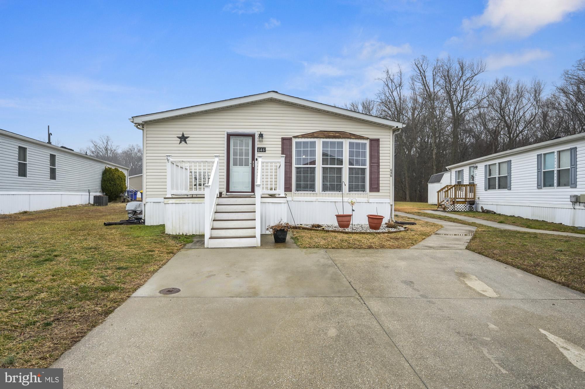Well-maintained 3 bedroom, 2 bath home in excellent condition! This bright and inviting home features a sunny eat-in kitchen with abundant cabinetry, center island, and plenty of counter space—perfect for everyday living and entertaining. A convenient laundry area is located just off the kitchen.
The home offers a spacious living room and a comfortable main bedroom suite with a large bathroom featuring a double vanity, stand-up shower, and walk-in closet. New laminate flooring has been installed in the living room and all bedrooms, adding a fresh, modern feel throughout. 
Enjoy additional outdoor storage with a backyard shed. New Roof in April 2021.

Located in a leased land community. All buyers must do application and receive park approval, including credit and background checks, prior to settlement.  Trash, Water and Sewer included in the monthly lease.