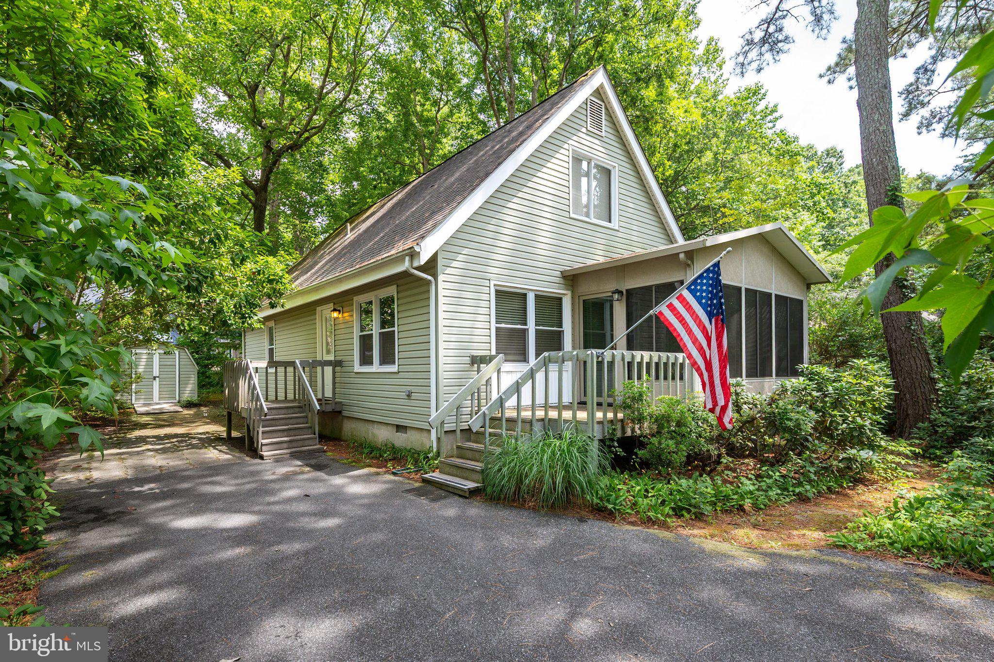 A lovely home, a great location, and a great price! Tucked in the serene confines of Sherwood Forest, and yet only a short distance to South Gate of Ocean Pines, this charming 3 Bedroom, 2.5 bath home features 2 FIRST FLOOR bedrooms. One first floor bedroom features an en suite half bath, the full bath is in the hall for both bedrooms to share. Upstairs there is a bedroom, full bath, and a large bonus room with plenty of possibility. Just some of the many features in this home are an open floor plan, updated kitchen with stainless steel appliances, updated bathrooms, gas fireplace, and beautiful LVP floors through the living room, sunroom, and kitchen. Outside there is a deck on the front of the home, a balcony in the rear.  Plus a paved driveway and  a storage shed. This home is just what you are looking for, schedule a showing today!