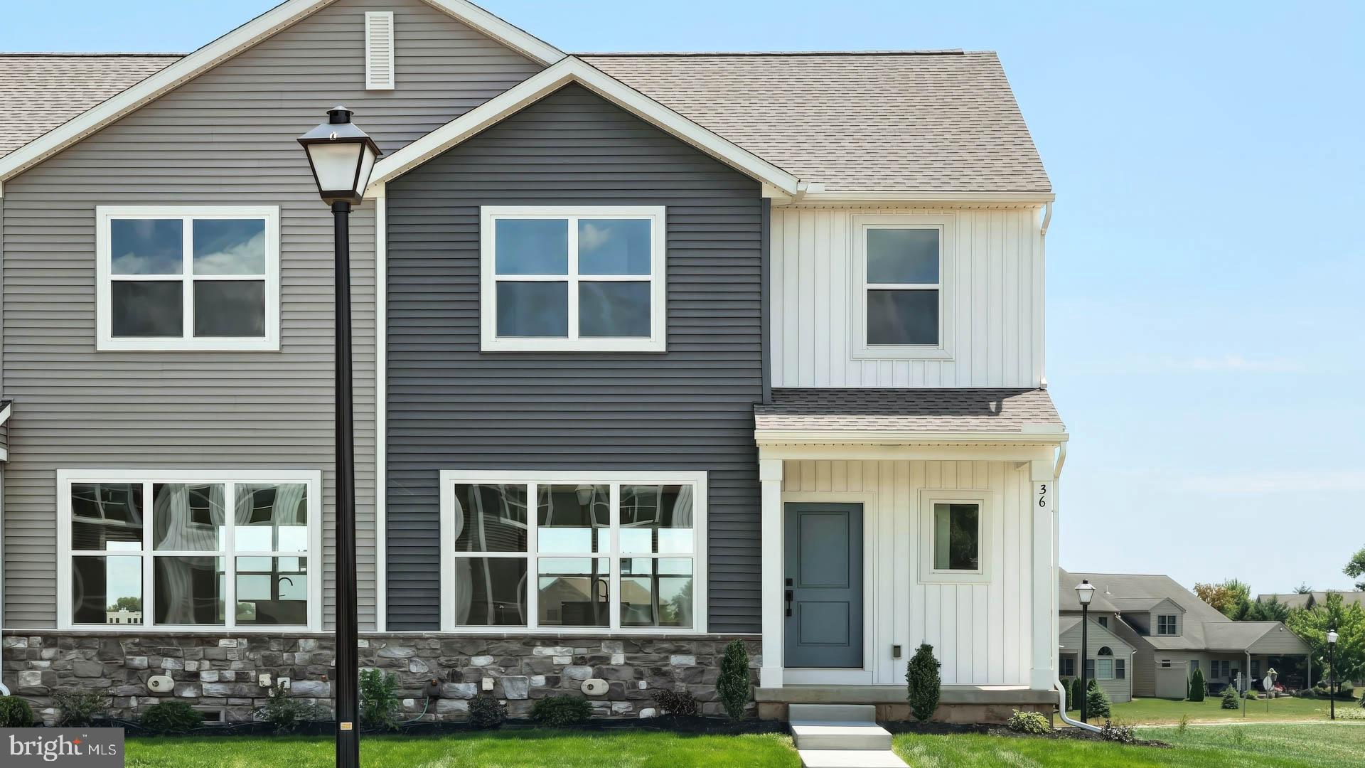 This charming 2-story, end-of-row townhome includes a 1-car, rear load garage, 9’ ceilings on the first floor, and a composite deck for outdoor living. Stylish vinyl plank flooring flows throughout the first floor. The foyer opens to a bright and open family room. The kitchen is well-appointed with stainless steel appliances, quartz countertops, and dining area. On the second floor, the owner’s suite features an expansive closet and a private bathroom. Adjacent to the suite are two additional bedrooms, a full bathroom, and a laundry closet. Images may include virtual furnishings for illustrative purposes only.