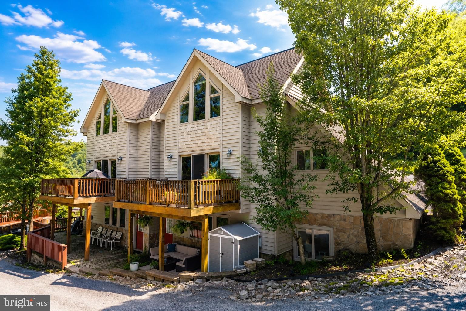 Looking for a beautifully updated condo at Deep Creek Lake? Welcome to 256 Jeffrey Lane #28, a spacious 3-bedroom, 3.5-bath condo in the desirable Traders Landing community. Enjoy filtered lake views from this well-appointed home, conveniently located just across the street from the water and only minutes from Wisp Resort, restaurants, shopping, marinas, and other area attractions. With a northern exposure that provides comfortable natural light throughout the day, this  property has been thoughtfully updated with a renovated kitchen, modernized bathrooms, and stylish furnishings.  This condo offers an excellent opportunity for both personal enjoyment and investment potential. Opportunities to own in Traders Landing are rare—schedule your private showing today!