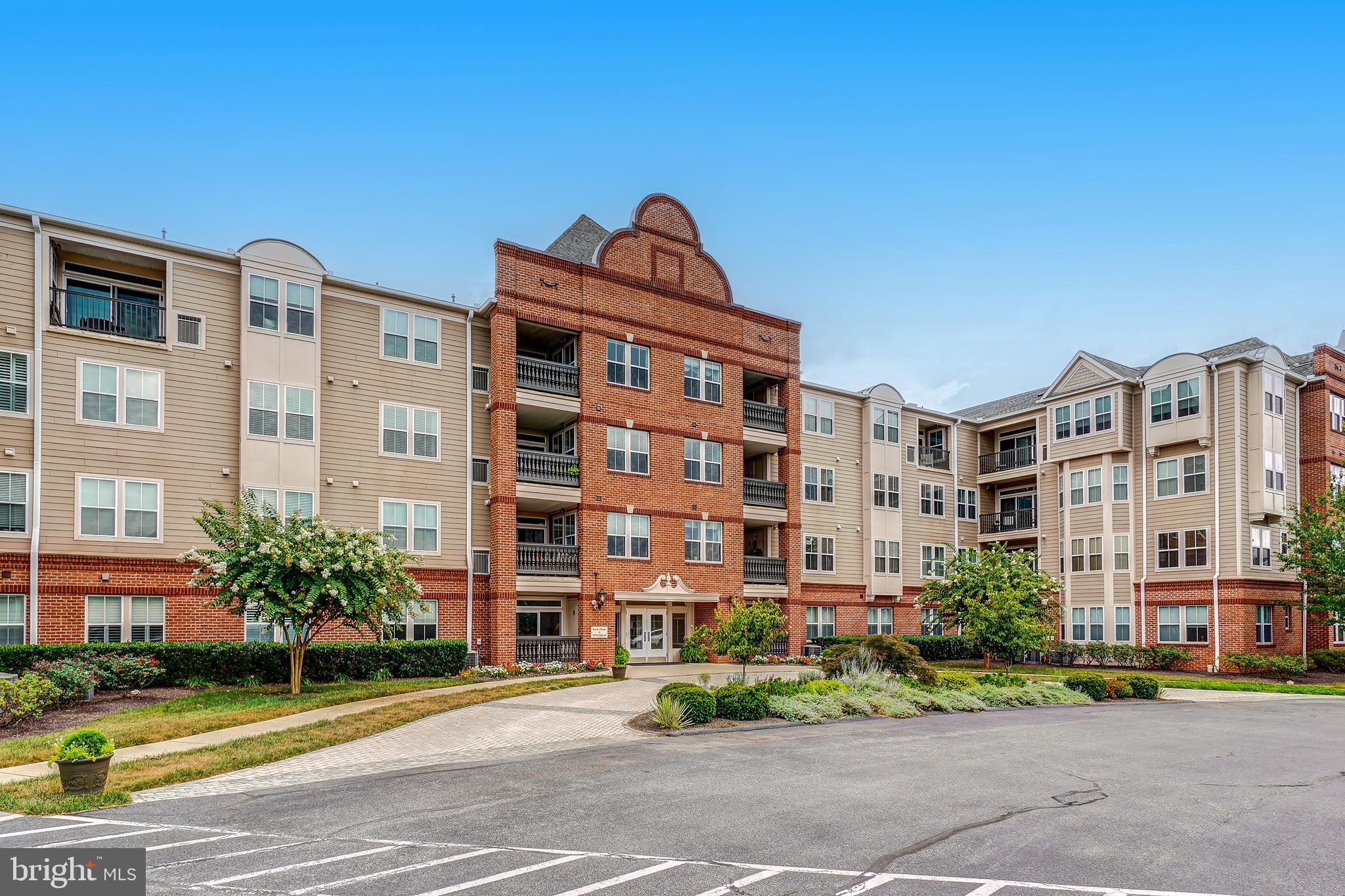 Experience refined main-level living in this gorgeous condominium residence. The open-concept floor plan showcases gleaming hardwood floors, a gourmet kitchen, three spacious bedrooms, and two beautifully appointed full baths. A warm fireplace creates an inviting focal point in the living area, while the walk-out patio offers a seamless extension of the living space for relaxing or entertaining.

Convenience meets elegance with a generously sized storage room just off the kitchen, as well as a separate laundry room designed for everyday ease. Garage parking is also included.

Residents enjoy access to the exceptional amenities of Worman’s Mill, including the beautifully appointed clubhouse with a resort-style pool, along with nearby boutique shopping and an array of outstanding dining options.