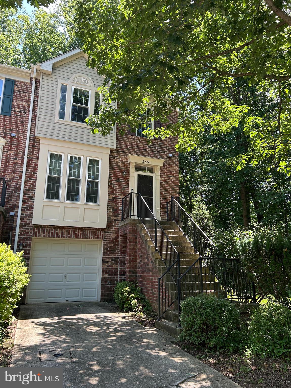 This End of Group Townhouse in Highly Desirable Trails at Woodlot Community has gleaming hardwoods, spacious kitchen cabinets and 9' ceilings.  There's plenty of light though the home, including the kitchen and living room bump out windows, and sliders to a deck overlooking beautiful views of woods and nature.  All three bedrooms have vaulted ceilings. The nicely sized family room has a brick wood burning fireplace including tools, and a full bath.  Laundry room has plenty of storage space.  Trails at Woodlot is a quiet oasis in the middle of Columbia without the Columbia Association Fees. Upgrades include: Rheem Water Heater-2018; Carrier HVAC-2022; Garage Door Opener-2024; New Roof-2014; Front Windows Replaced