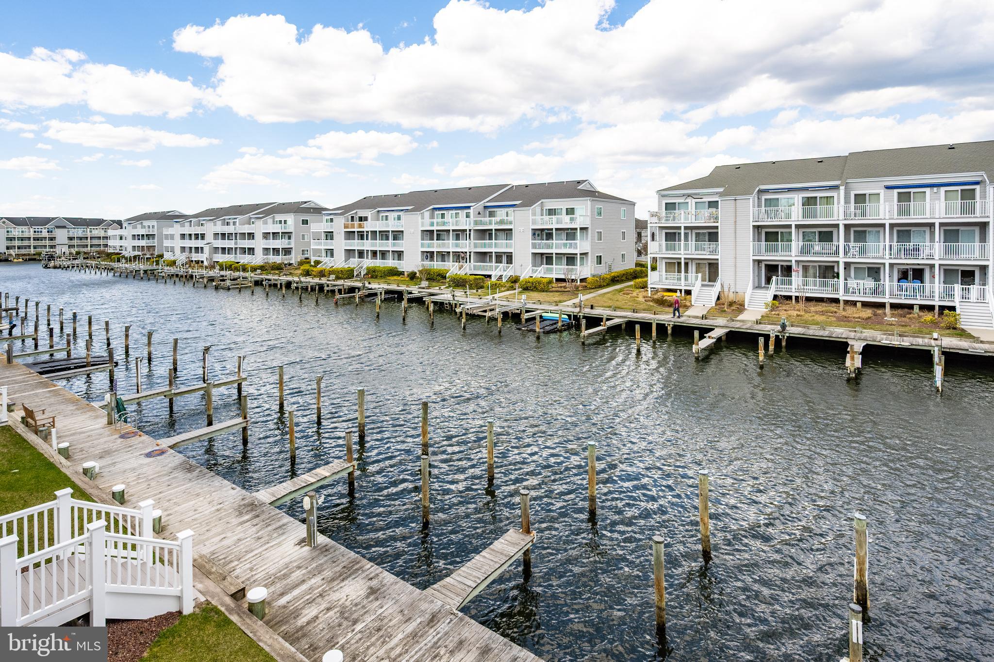 Discover waterfront living at its finest in this beautifully renovated and fully furnished 2-bedroom, second-floor condo in the sought-after Hidden Harbour I community. This bayside retreat boasts breathtaking water views and is in perfect move-in condition—ideal as a second home or as an investment property. This section of Hidden Harbour Phase I permits short-term rentals, adding to its appeal.
Inside, luxury vinyl plank flooring flows throughout the main open living areas, while carpeting adds comfort to the bedrooms. The renovated primary bath showcases a stunning walk-in shower, modern vanity, updated flooring, and stylish lighting. The updated kitchen is a delight, featuring upgraded cabinetry, a chic backsplash, and stainless steel appliances.
The spacious living area is bathed in natural light, thanks to Pella sliding glass doors that open to a covered porch overlooking the neighborhood boardwalk and serene canal/bayside waters. Elegant custom Plantation Shutters enhance both the sliding doors and windows, providing privacy and style.
Additional updates include an upgraded/replaced HVAC system (2022) for year-round comfort. Hidden Harbour I offers fantastic amenities, including an outdoor neighborhood pool. Conveniently located within walking distance to Northside Park, the beach, and an array of restaurants and shops, this exceptional property invites you to embrace the coastal lifestyle.
Don't miss the chance to own this waterfront gem—schedule your showing today!