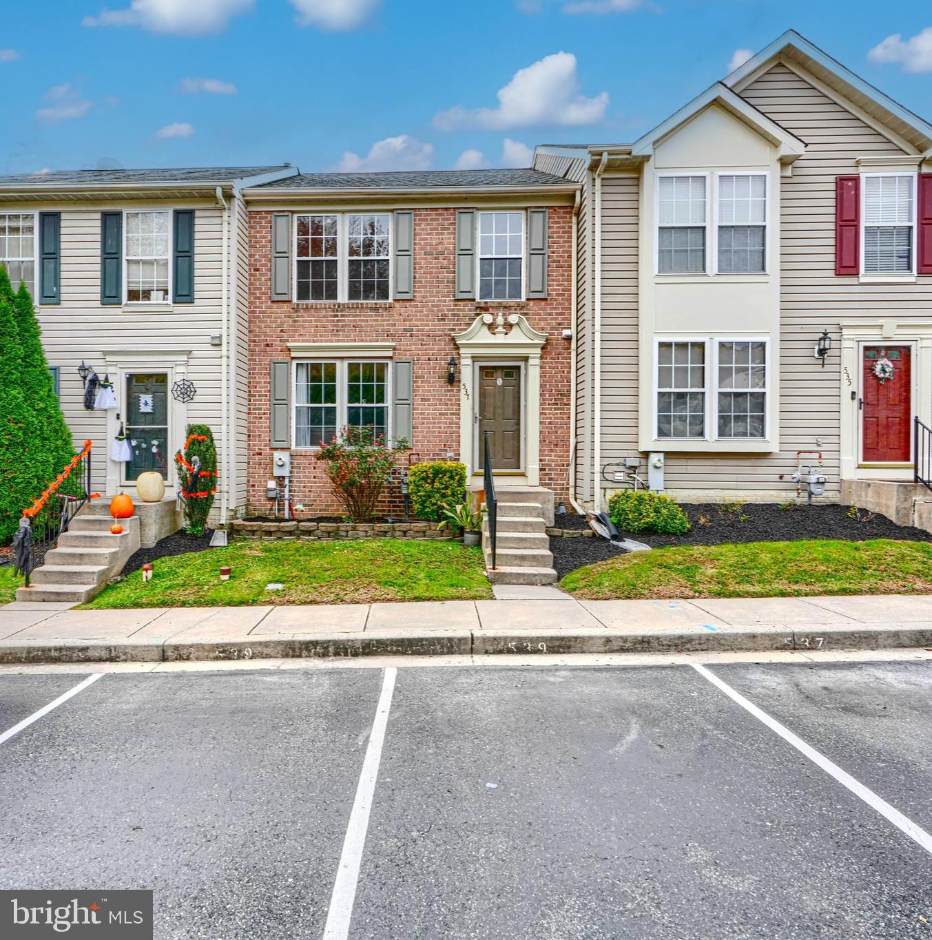 Outstanding Brick Townhome! This beautiful home features a  two-level bump-out adding incredible space and natural light. The open-concept kitchen flows into a cozy breakfast area and a sunroom with vaulted ceilings and luxury vinyl wood flooring — perfect for relaxing or entertaining. The living and dining rooms boast gleaming hardwood floors, while all bedrooms and the sunroom offer soaring vaulted ceilings for an airy feel. Enjoy a fully finished lower level with a spacious recreation room , new carpet, and an additional 4th bedroom or den, plus a newly updated powder room on the main level. Recent upgrades include a new water heater, new sump pump, new dishwasher, new kitchen flooring, freshly painted deck and interior, a brand-new upstairs hall bath, and even a newer roof! Enormous deck overlooking the privacy of the trees!  Conveniently located near shopping, dining, and major commuter routes, this brick-front beauty offers 2 assigned parking spaces, lawn care, snow removal, and trash service included. This one won’t last long — move-in ready and waiting for you!