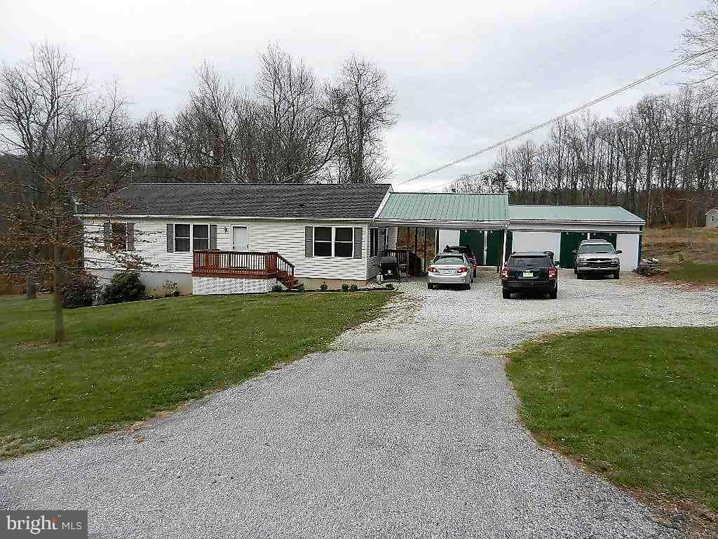 Nice, country setting on 1.67 acres.  This 11-year-young home shows pride in ownership thru-out.  Attached car-port & 30x40 pole bldg w/ cement flr.  This 3BR, 2 full BA home comes w/ a whole-house generator.  Move-in ready!  Set up a showing today!!