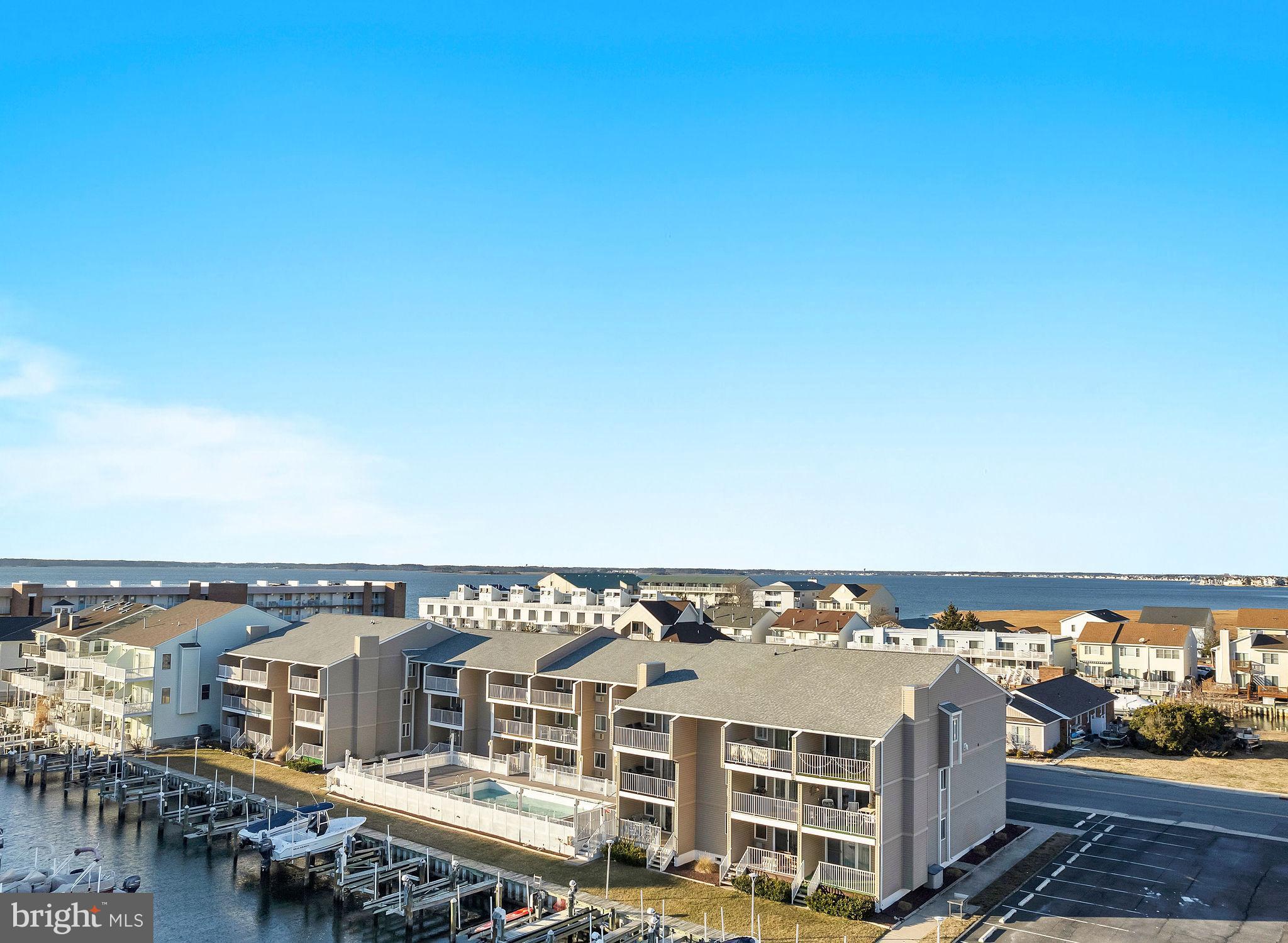 Welcome to Barbados Sun 202, a beautifully updated 2-bedroom, 1-bathroom waterfront condo in the heart of Ocean City. Located on 94th Street, this prime spot is just moments from Acme, The Coffee Beanery, BlueFish, Bull on The Beach, the beach, and many other popular attractions! Step inside to find Brazilian cherry flooring throughout, with brand-new carpet in the bedrooms.The open-concept living space is enhanced by 5/8” fire code sheetrock on the ceilings and most walls, providing peace of mind and sound insulation. Enjoy stunning canal and bay views from your large private balcony, perfect for relaxing or entertaining. Boating enthusiasts will love Boat Slip 202, complete with a fully powered boat lift and direct bay access. Additional community amenities include a secure bike room, an outdoor pool, a BBQ/picnic area, and a fish prep station—ideal for those who love waterfront living. Don’t miss this opportunity to own a waterfront retreat in one of Ocean City’s most sought-after locations!