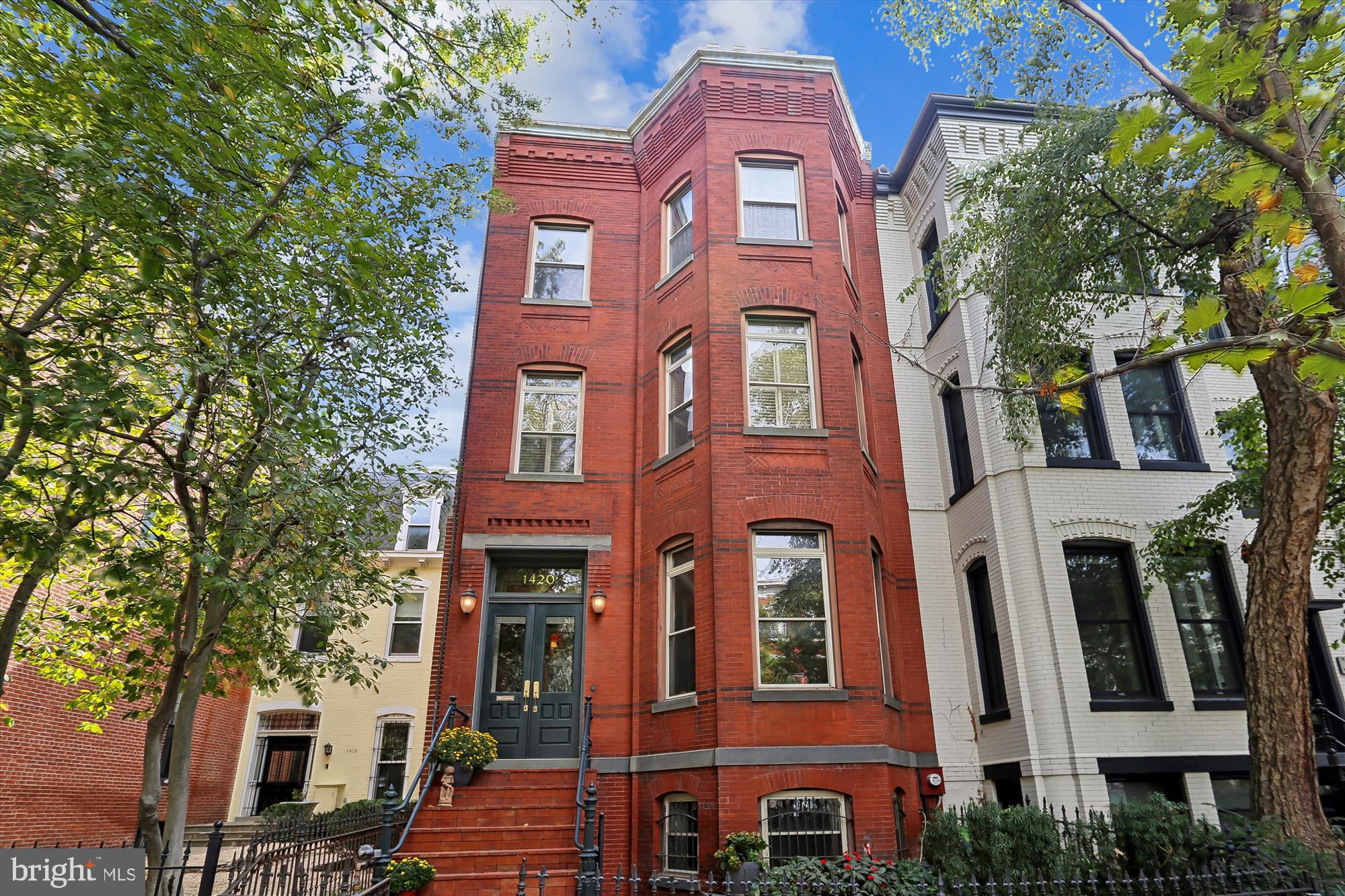 LOCATION! LOCATION! LOCATION! 1420 Q Street, NW, is an exceptional property located in the heart of historic Logan Circle. This 1880’s, 21.5’ wide, four level Eastlake Victorian offers an incredible opportunity to reside on the Best Block adjacent to the vibrant 14th Street Corridor. HIGHTLIGHTS: 6BRs/3.5BAs; 4,200 sq. ft.; Ceiling heights: 11’,10’ , 9’; Zoning Approved lot coverage expanded from 60% to 66.14%; Huge south and west facing deck off the Kitchen; 2 car parking; VACANT 1BR English Basement apartment (previously rented at $2,685/mo); Newer systems (HVAC, W/D, W/H, Kitchen appliances). The elegant proportions of this grand home offer a comfort and refinement only found in a truly exceptional property. The home is accented throughout with heart pine floors, plaster ceiling medallions and crown moldings. On the main level, two Eastlake marble mantels (with gas log sets), a north facing bay and two turn-of-the-century chandeliers add Gilded Age ambience for the Living and Dining Rooms. The Kitchen features an energy efficient LG refrigerator, Bosch D/W, vented commercial grade range hood, soft close cabinets, LED lighting, oversized S.S. deep sink, conveniently located pantry for extra storage and a Powder Room. The home’s entire second level is a Primary Bedroom Suite (See DOCUMENTS for architect designed re-imaged PBR/PBA). The spacious Bedroom features an arched sleeping alcove, crown moldings and heart pine floors. The Primary Bathroom features a jetted tub, dual sinks, separate shower, linen closet and updated Kohler faucets/showerhead. The middle Bedroom currently serves as a Den/Library and features a marble mantel (gas log set), and built-in bookcases. The hallway features custom-designed closet storage systems and new stacked high-efficiency Electrolux W/D. The third level features three Bedrooms. The multi-function rear BR could easily be used as a home office as it features built-in cherry cabinets, SS bar sink, granite counters and an under-counter refrigerator. The updated hall bathroom features heated Carrara marble floors, glass shower enclosure and linen closet. The one Bedroom English basement apartment’s living space features a gas fireplace, Kitchen w/ stacked Bosch W/D, gas furnace and 50-gallon water heater (both new in 2021), large BR with walk-in closet plus front and rear unit egress. Previously rented for $2,685 a month (utilities inclusive), and with a Certificate of Occupancy, it provides an attractive contribution to a Buyers’ monthly mortgage payment. The expansive main level south and west facing rear deck was designed with low maintenance Trex decking, red cedar privacy walls and stainless-steel cable railings. The stairs and blue stone paver pathway lead to two car parking and under-deck storage. In addition to the original cast iron railings, the 1880’s brick façade features black accent brick work with stepped brick cornice and slate windowsills. The HVAC for the main house and the rental unit were installed in 2021. With this incredible location, you can easily imagine living in the heart of vibrant Logan Circle, steps to award winning restaurants, theater, coffee shops and grocery stores (Whole Foods, Trader Joe’s).