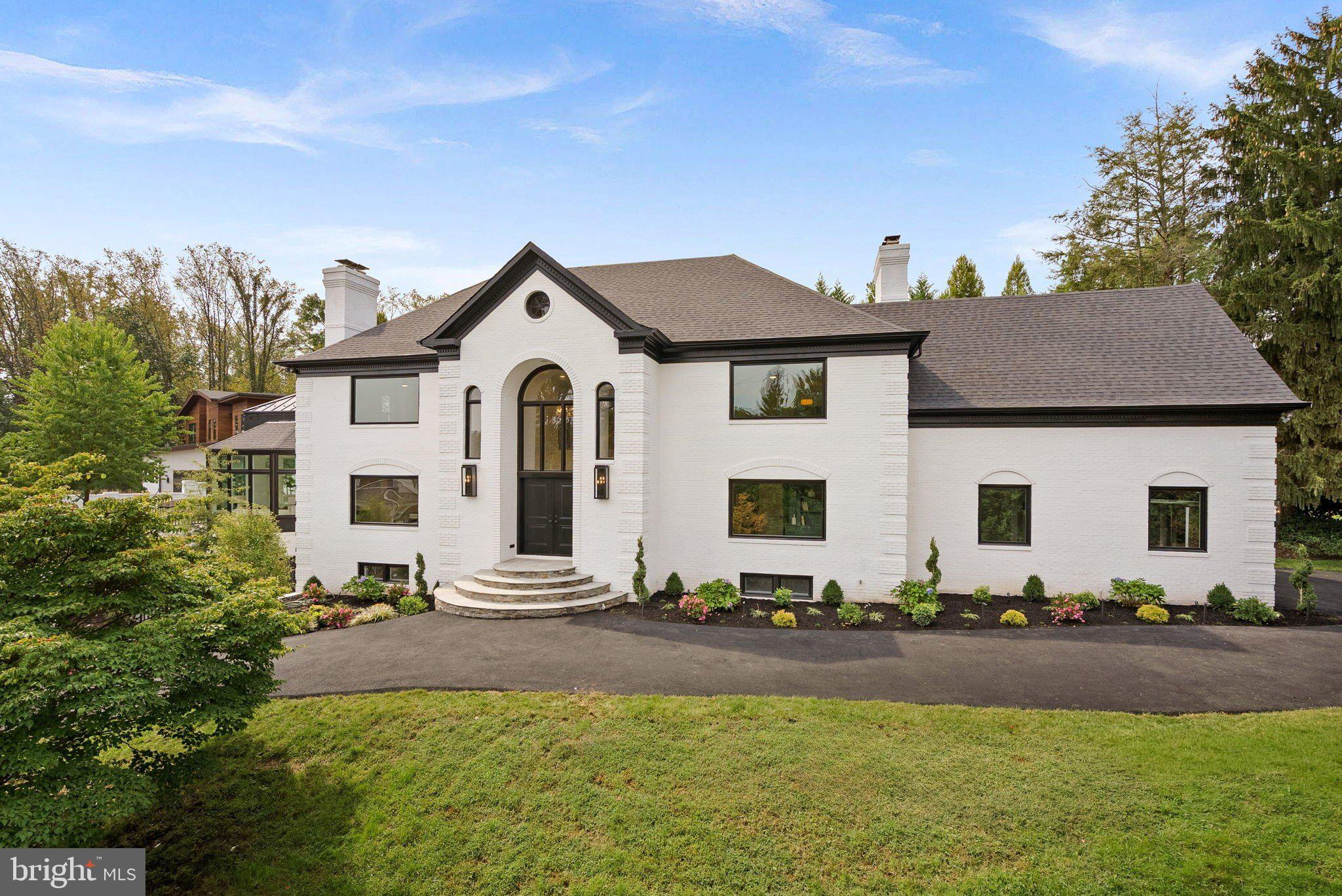 Welcome to 6121 Long Meadow Road, a top-to-bottom fully reimagined residence that blends timeless elegance with modern luxury. Perfectly located near the Potomac School, Langley Fork Park, Clemyjontri Park, and just minutes from Great Falls Park, Tysons Corner, and the cultural offerings of Washington, D.C., this home offers the ideal balance of serene living and urban convenience. Step into the grand two-story foyer with a new custom staircase that sets the tone for the impressive interiors. The main level features a refined office with glass doors, built-in shelving, and a wet bar. The formal dining room has a dramatic floor-to-ceiling quartz fireplace wall and the spacious family room with a classic wood-burning fireplace. The brand-new chef’s kitchen boasts top-of-the-line appliances, quartz countertops, designer cabinetry, and a butler’s pantry with a private kitchenette. A sun-drenched solarium framed by walls of glass brings the outdoors in, creating a perfect space for entertaining or relaxation. Upstairs, the luxurious owner’s suite is a private sanctuary, complete with two custom walk-in closets, a sitting room with a fireplace, and a spa-inspired bath featuring dual vanities, a sauna, oversized walk-in shower with dual showerheads, and a striking centerpiece soaking tub. Additional two bedrooms include a Jack-and-Jill suite, a private en suite, and a conveniently located laundry room. A spacious loft with a full bath offers flexible living space. The lower level is designed for both recreation and wellness, featuring a media room with bar seating, a wet bar, mirrored fitness studio with sauna, multiple full baths, and an additional bedroom. Outdoor living is just as inviting with a newly finished paver patio, ideal for al fresco dining and entertaining. With a new roof, windows, doors, flooring, baths and more throughout, this extraordinary residence offers the rare opportunity to own a move-in ready luxury home in one of McLean’s most coveted locations.