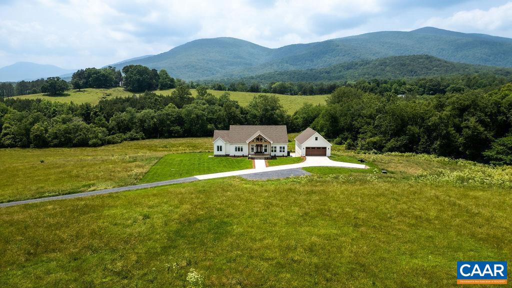Located in one of the most desirable areas of Afton, Virginia, this stunning 5-bedroom, 4.5-bath home sits atop 20 acres of breathtaking mountain views. Built just two years ago, it offers the perfect blend of modern comfort and serene country living.With no restrictions or HOA, this property is ideal as a private family compound with space for additional homes, or as a picturesque horse farm with a separate barn. Whether you're seeking a primary residence, a weekend retreat, or an income-producing investment, this oasis fits the bill?currently generating a Net income of $95,000 annually.Offered fully furnished and sold turnkey, this exceptional property is ready for you to move in and enjoy from day one.,Quartz Counter,White Cabinets