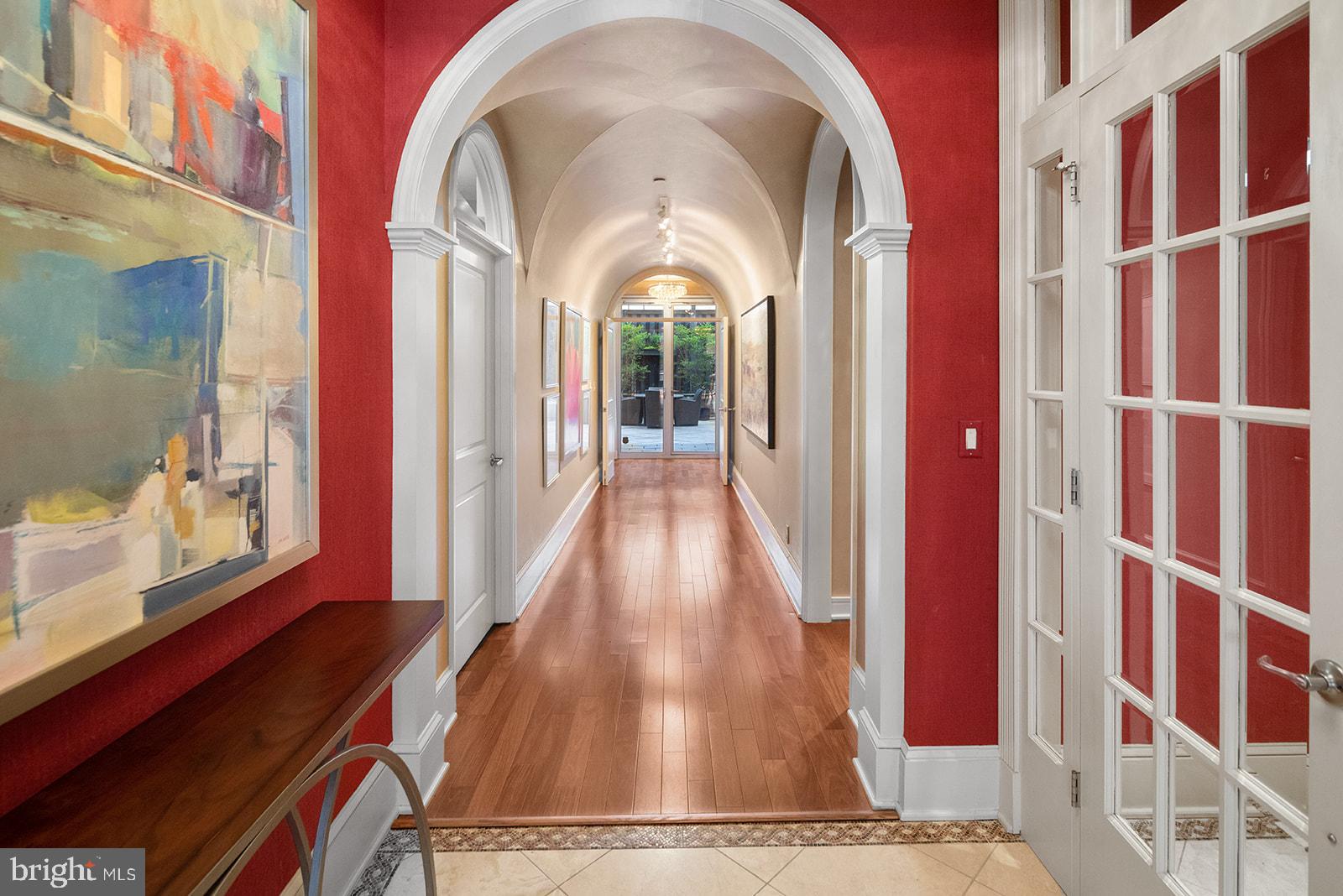 Imagine walking off of an elevator directly into your own full-floor condominium.  Without cramped hallways to share with other residents, this beautifully appointed and refined condo feels very private and exceptionally luxurious. Unit 200 at the pet-friendly “The Beaumont” features two (2) car parking in a gated enclosed garage, as well as, one of the largest outside terraces in the neighborhood … just perfect for both relaxing nights at home or sharing glasses of wine with ALL  of your friends. The 900 sq. ft. terrace has that wow factor, with its extremely high privacy fence that sits on a stone base, many large wall sconces, trendy floor pavers, and an irrigation system!  It is such a great opportunity to own a split two (2) bedroom, two and a half (2.5) bath home located in a vibrant and energetic part of the city, while still offering your own personal oasis. This exceptional 2740 sq. ft condo boasts a separate entrance anteroom, an open floor plan with a large window expanse, Santos Mahogany hardwood floors, a barrel ceiling hallway connecting east to west, ceiling fans, track and recessed lighting, sconces and three (3) chandeliers, a built-in entertainment console with gas fireplace and built in desk, a gourmet kitchen with high-end appliances, Sub Zero refrigerator, GE Monogram double wall ovens and four burner range with with grill, Fisher & Paykel double dish drawers, soapstone and granite countertops, extra large island, a main bedroom large enough to make a cozy sitting area, a finished walk-in closet, Calcutta marble bath, two (2) person shower with body sprays and a soaking tub, a separate toilet room with bidet, and a bar alcove with copper sink and built-in Sub Zero wine fridge. There are a total of three outdoor spaces.  In addition to the private terrace, there is a balcony in the front overlooking green space, and the future Penn's Landing Park, connecting you directly to the Delaware River. From a functional standpoint, there is a laundry room with storage cabinetry and washer and dryer, several storage closets, TV’s, Silhouette type blinds, tasteful draperies, and a Virtual Concierge for the building. Come see this luxuriously appointed, move-in ready home, and experience everything it offers. This refined space is the perfect place to call home.