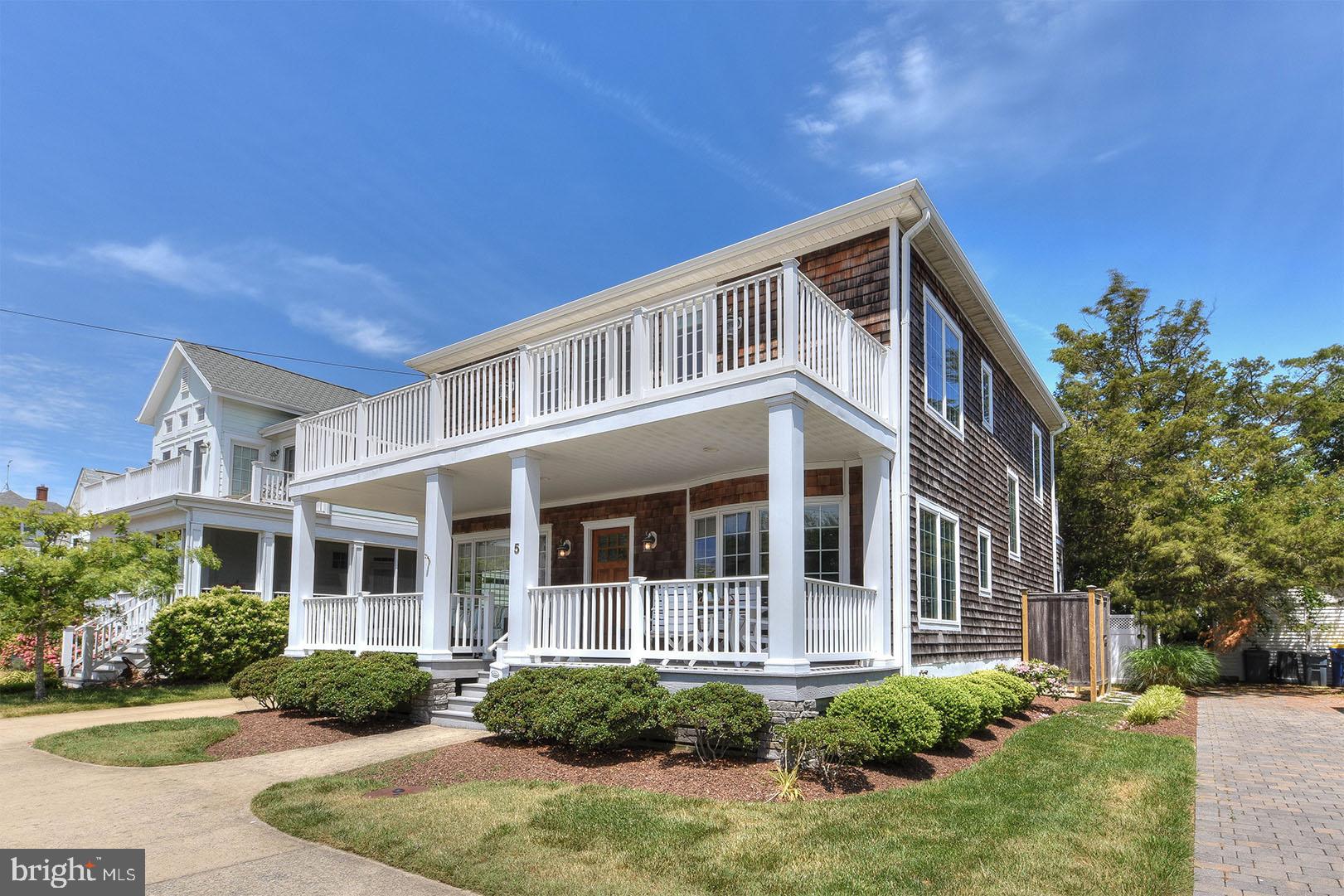 Welcome to 5 New Castle Street! This ocean block home with garage apartment in South Rehoboth is just steps to the beach, boardwalk and Rehoboth Avenue and includes a total of 6 bedrooms, 4.5 bathrooms. Numerous features could not be duplicated under today's building code. The first floor of the main house includes a large front porch, eat-in kitchen with granite counters and stainless steel appliances, spacious living room, den, and first floor master bedroom with adjacent full bath. Step upstairs to find a master suite with private deck that overlooks the ocean, plus two additional guest bedrooms and full bath. In the rear of the property sits a 2-car garage with a 2 bedroom, 1 bath apartment on the second floor and includes a living room, kitchen, and hardwood floors. Exterior features include an outdoor shower and three off-street parking spaces. This home offers excellent rental history and produces over $100,000 of income each summer. Unique opportunity to rent one unit and enjoy the other for yourself. Don’t miss this opportunity to own an investment property or summer beach retreat!
