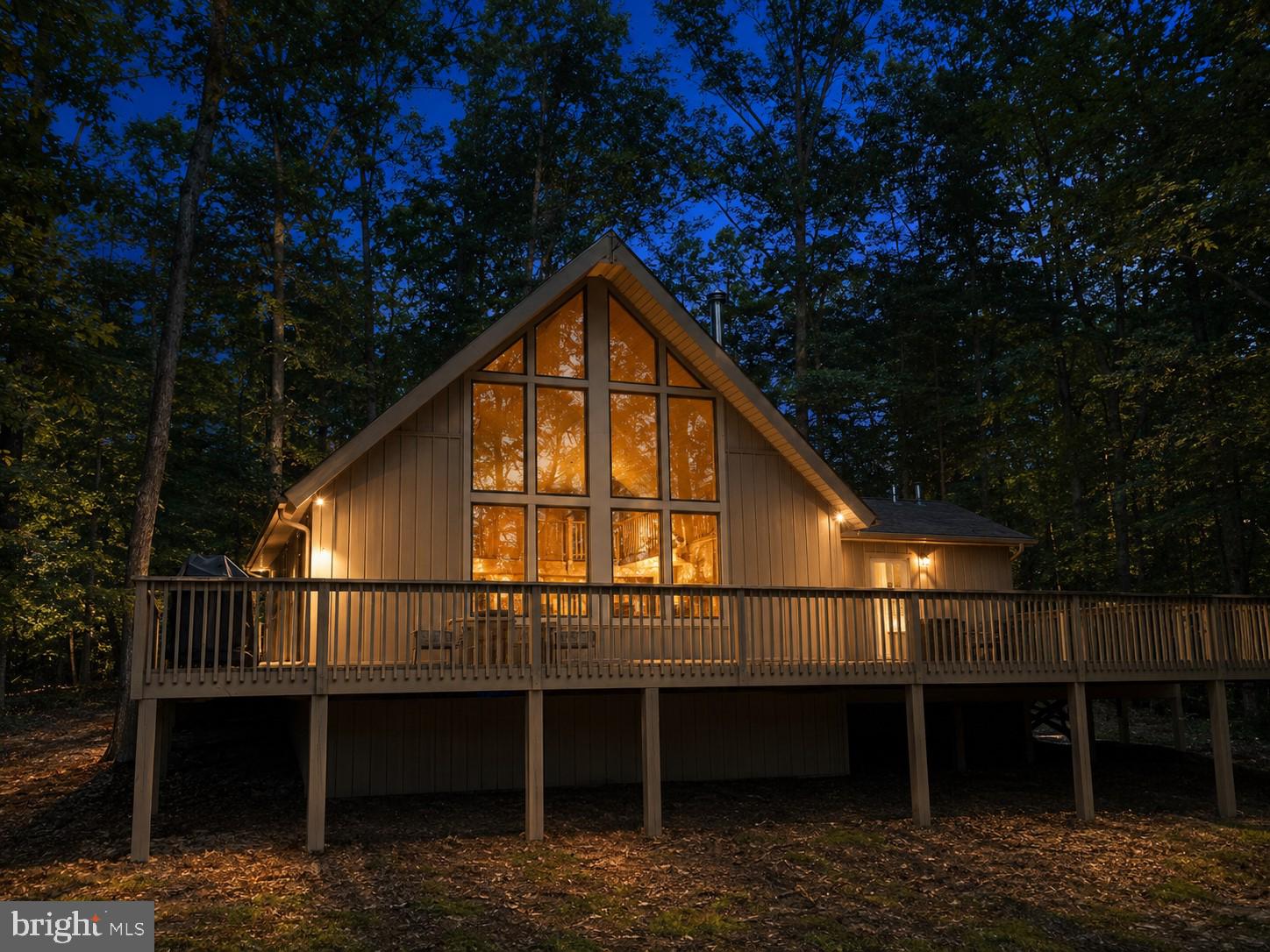 Enjoy a relaxing retreat in The Woods! This fully furnished Elmwood chalet is ready for you to pack your bags and settle in.  Surrounded by mature hardwoods, the home offers low-maintenance vinyl siding, a spacious deck for outdoor entertaining and a private hot tub.

Inside, the remodeled living area features vaulted wood ceilings, a wall of windows and a cozy nook that can accommodate a futon for additional sleeping space. The main level includes a spacious kitchen with built-ins and ample storage, along with a primary suite offering a private bath, generous closet and convenient laundry facilities. Upstairs, the open loft provides additional room for sleeping or relaxing.

Whether you are searching for a weekend getaway or a peaceful place to call home, this furnished chalet is ready to enjoy. The seller has a transferable Class B membership available.