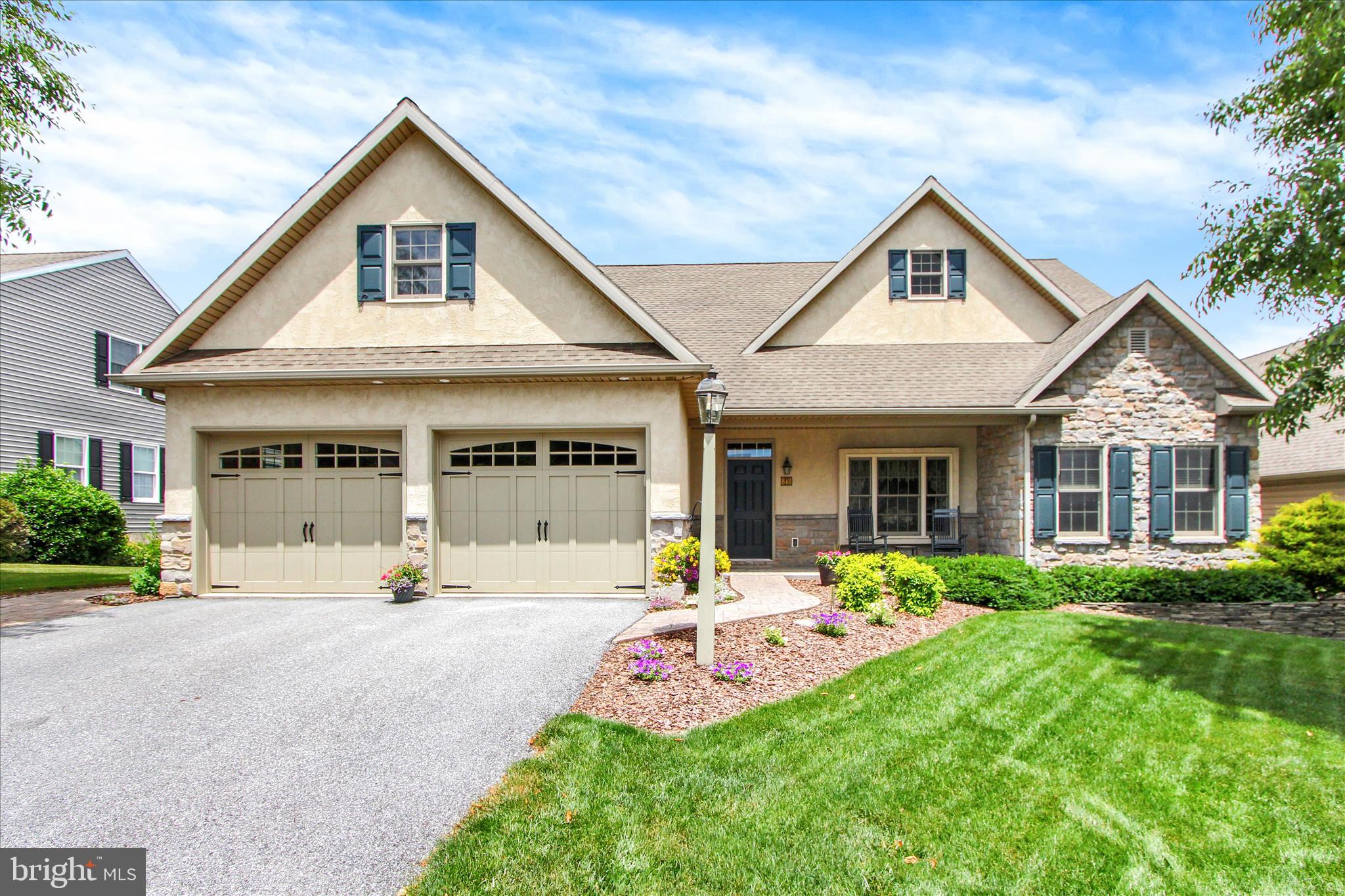 This is the one you've been waiting for! Retire in style and enjoy exceptional living in this beautifully upgraded home featuring an open, light-filled floor plan, stunning hardwood floors, cathedral ceiling, and a gourmet kitchen designed for both everyday living and entertaining. The kitchen showcases a large island with breakfast bar seating,  illuminated glass-front cabinets, under counter, pendant and recessed lighting, newer appliances, and expansive counter space for gathering with family and friends. Enjoy your beautiful loft view & additional storage area overlooking the open floor concept. The dining and living areas are warm and inviting with a gas fireplace and easy access to the deck for outdoor grilling and enjoying sunset views for miles! The spacious primary suite offers great space with a large W-I-C and bath featuring dual vanities & garden tub for your enjoyment. The finished lower level provides incredible flexibility with a second kitchen, bedroom and bath making it ideal for in-law quarters, extended guest stays or the ultimate entertainment space. Additional features include central vacuum, generous storage, gas heat and gas water heater. Enjoy the community amenities including an exercise room, recreation facilities, walking paths, lake privileges, streets/sidewalk snow removal and trash service. This exceptional home combines comfort, convenience, and lifestyle in one outstanding package! Prof photos coming