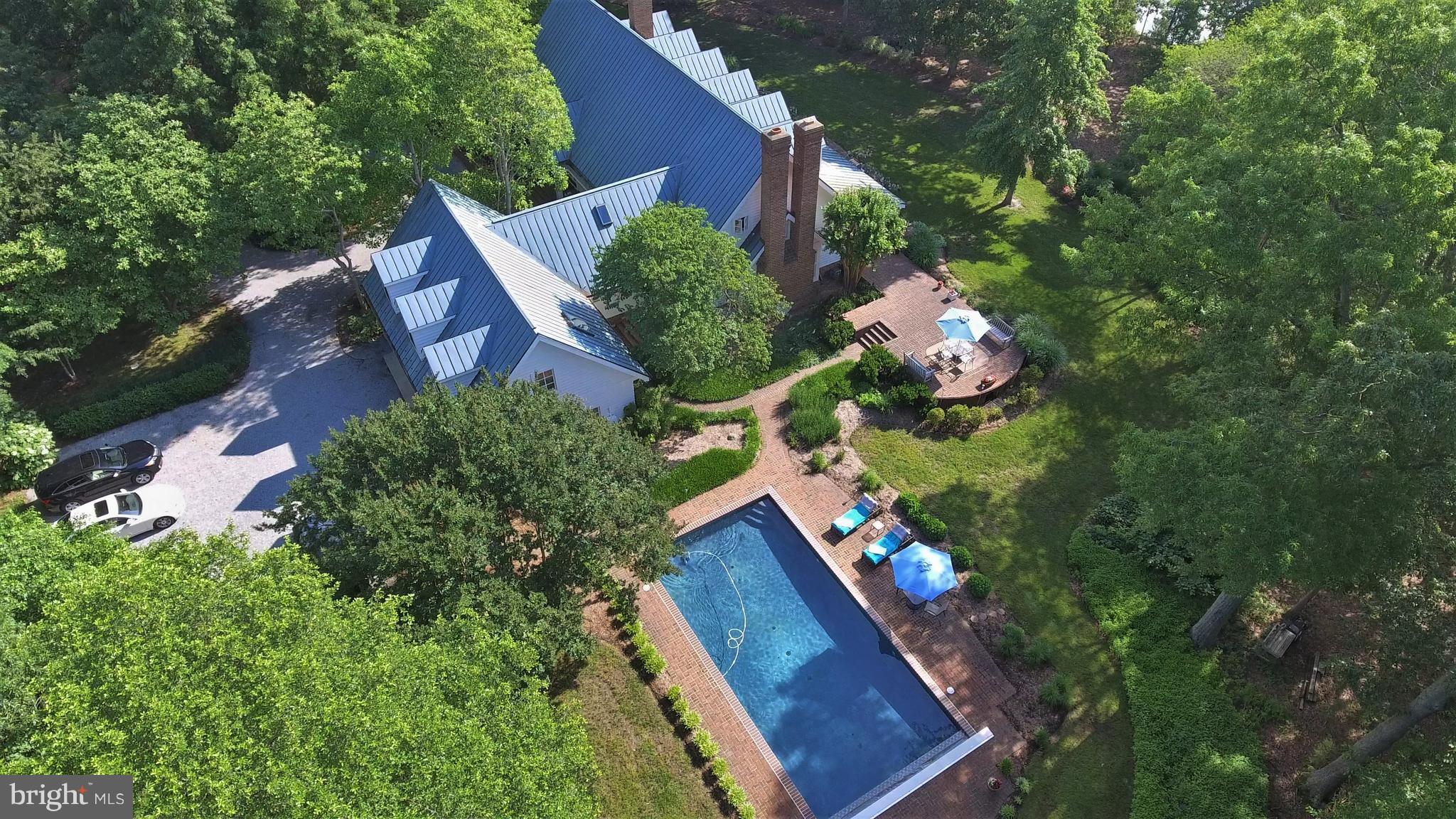 Award Wining Waterfront Home on 26.8 Ac w/over 750' shoreline on Buzzard Island Creek. Easy commute to DC this property inc. a 5038 sf. home w 2 master suites, water views from all rooms, sauna, salt water pool, extensive covered porch, covered boat house w lift,  a 6000 sf matching building w Htg & AC for addnl garage space, office, full bath w/shower, laundry facility. Prior  equestrian use.