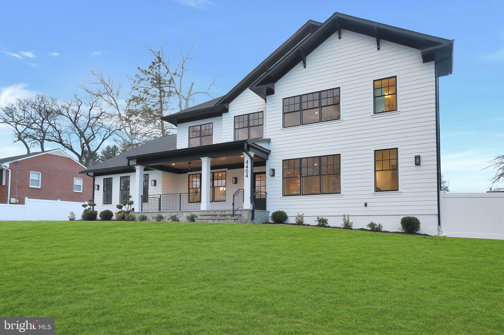 Welcome to 4404 Clearbrook Ln, a breathtaking 7,000 sq. ft. home in the heart of Kensington, seamlessly blending luxury, comfort, and convenience. Nestled on a picturesque flat lot, this 6-bedroom, 6.5-bathroom residence is designed for effortless living, featuring an inviting front porch, a spacious deck, and a beautifully landscaped backyard—perfect for both relaxation and entertaining. The main level includes a private in-law suite, ideal for guests or multi-generational living, while the three-car garage, complete with windows, plus an extended driveway, offers ample parking. For modern convenience, the home boasts 400 amps electrical panel, ensuring ample power for high-end appliances and future expansions, along with two electric car chargers for effortless EV charging. A backflow preventer adds an extra layer of protection to the home’s plumbing system. Hardwood floors span the main and upper levels, while the expansive finished basement features durable Luxury Vinyl Plank (LVP) flooring. The home is outfitted with Lifestyle Pella windows throughout, backed by a lifetime warranty, ensuring energy efficiency and long-term peace of mind. Built for both elegance and efficiency, this home includes a Trane gas furnace in the basement, a 16 SEER Trane heat pump on the second floor, and 2 tankless water heaters for endless hot water on demand. The architectural shingles come with a 40-year warranty, adding to the home’s durability. The gourmet kitchen is a chef’s dream, equipped with a 24” Thermador refrigerator, a 36” wide VentAHood range hood, and a 24” double drawer Jenn-Air refrigerator and Decor microwave drawer. Located just minutes from Grosvenor-Strathmore Metro, Rock Creek Park, and downtown Kensington’s charming shops, cafés, and farmers' market, this home is also part of the highly sought-after Walter Johnson High School cluster. With unparalleled space, state-of-the-art upgrades, and a prime location, this is a rare opportunity you won’t want to miss!