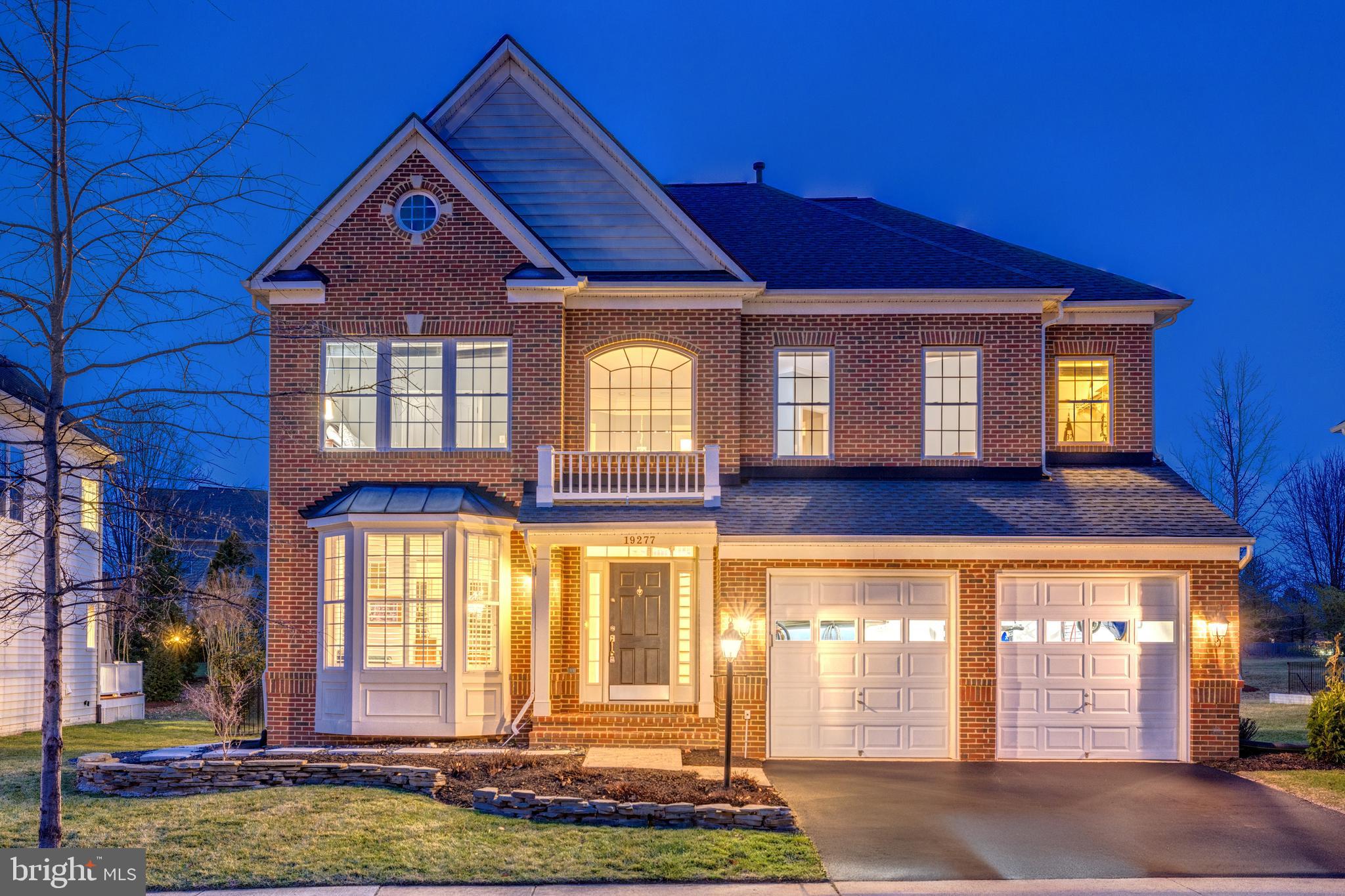 Open House Sunday March 23rd 2-4pm**Timeless Design Meets Modern Comfort. Enjoy indoor-outdoor luxury and extensive upgrades at this Contemporary Colonial home within Lansdowne on the Potomac. Arrive on tree-lined streets to the picturesque, brick-front residence. Inside, a grand two-story foyer introduces refinished hardwood floors that continue through the main level and stairs. Classical architectural elements grace the formal living and dining rooms, including bay windows, chair rails and wainscoting, and an ornate chandelier with ceiling medallion. The eat-in kitchen was recently remodeled, featuring a center island with bar seating and upgraded stainless appliances, including a Bosch dishwasher, Wolf 4-burner cooktop with griddle, Wolf wall oven, and Wolf microwave. Flow from the kitchen into the family room centered around a floor-to-ceiling stone gas fireplace. The main level powder bath was just remodeled in 2024. Upstairs, all four bedrooms are conveniently located together. The impressive primary suite features a private sitting area, tall tray ceiling, two walk-in closets, and an en suite bath with corner soaking tub, separate shower, and double sinks. Three more spacious bedrooms and a full remodeled bath complete this level. The finished walk-up lower level expands your living space with a flexible recreation area and upgraded kitchenette, full bathroom with updated vanity and faucet, and a bonus room perfect for guests, a gym, or home office. A utility room provides extra storage. The home’s outdoor spaces are equally inviting: relax on the updated deck, installed 2023 with TimberTech Legacy premium decking, or down on the paver patio and lawn with sprinkler system. An updated black aluminum fence surrounds the yard, all backing to mature aspen trees and common area. Additional recent updates include: new roof (2019/2020), new furnace (2020), new thermostats (2024). The location provides easy access to Lansdowne's amenities, including indoor/outdoor pools, fitness center with aerobics rooms, amphitheatre, playgrounds, tennis, pickleball, and volleyball courts, tot lots, recreation center with meeting rooms and ballroom, business center, game room, plus miles of trails connecting to Potomac Heritage Scenic Trail network. Conveniently close to Route 7, Lansdowne Town Center shopping/dining options, Golf Club at Lansdowne, Lansdowne Resort & Spa, hiking trails and Elizabeth Mills Riverfront Park. Experience relaxed living in this highly upgraded home in one of Loudoun County's most desired locations.