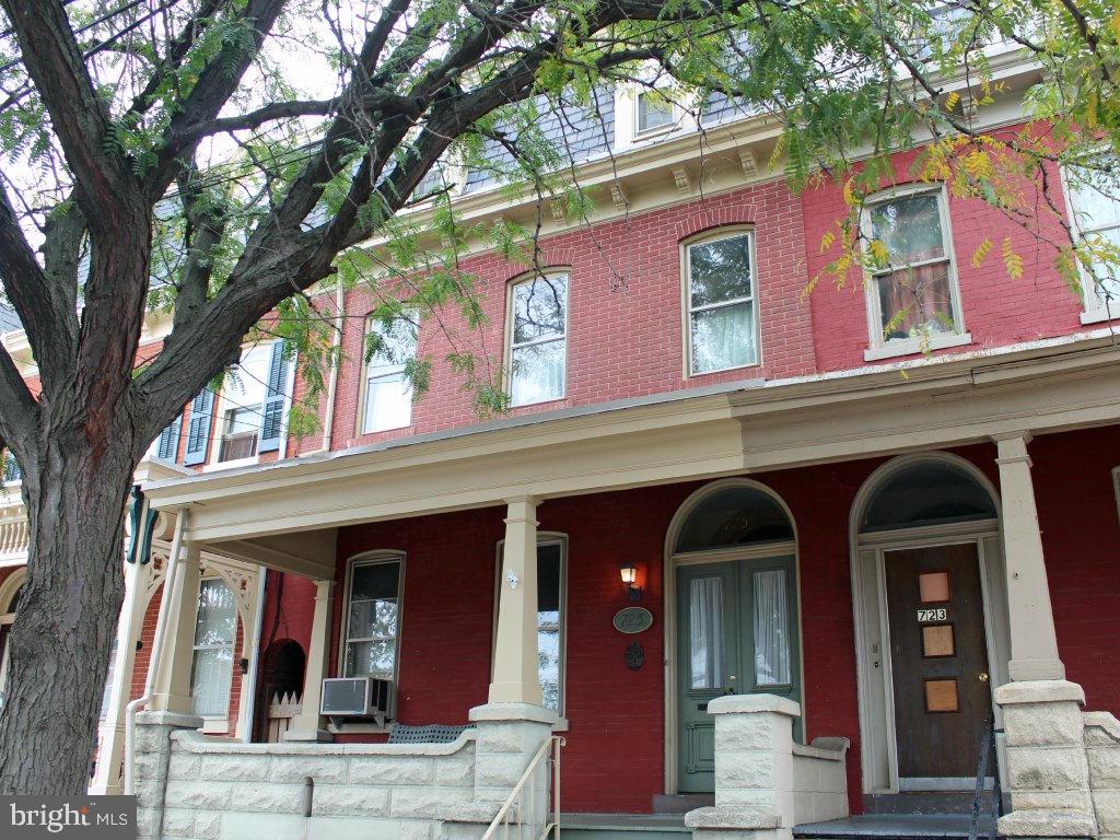 Need elbow room? This Lancaster City three story combines large living space, a private fenced rear yard, 91/100 walk score, off-street parking, & wall to wall value. Return to the classics with a double door vestibule, hardwood floors, open staircase, built-in China cabinet, & original woodwork throughout. Cool fall weather can be enjoyed on the covered front porch, side balcony, rear deck or patio. Add your updates to make this home amazing.