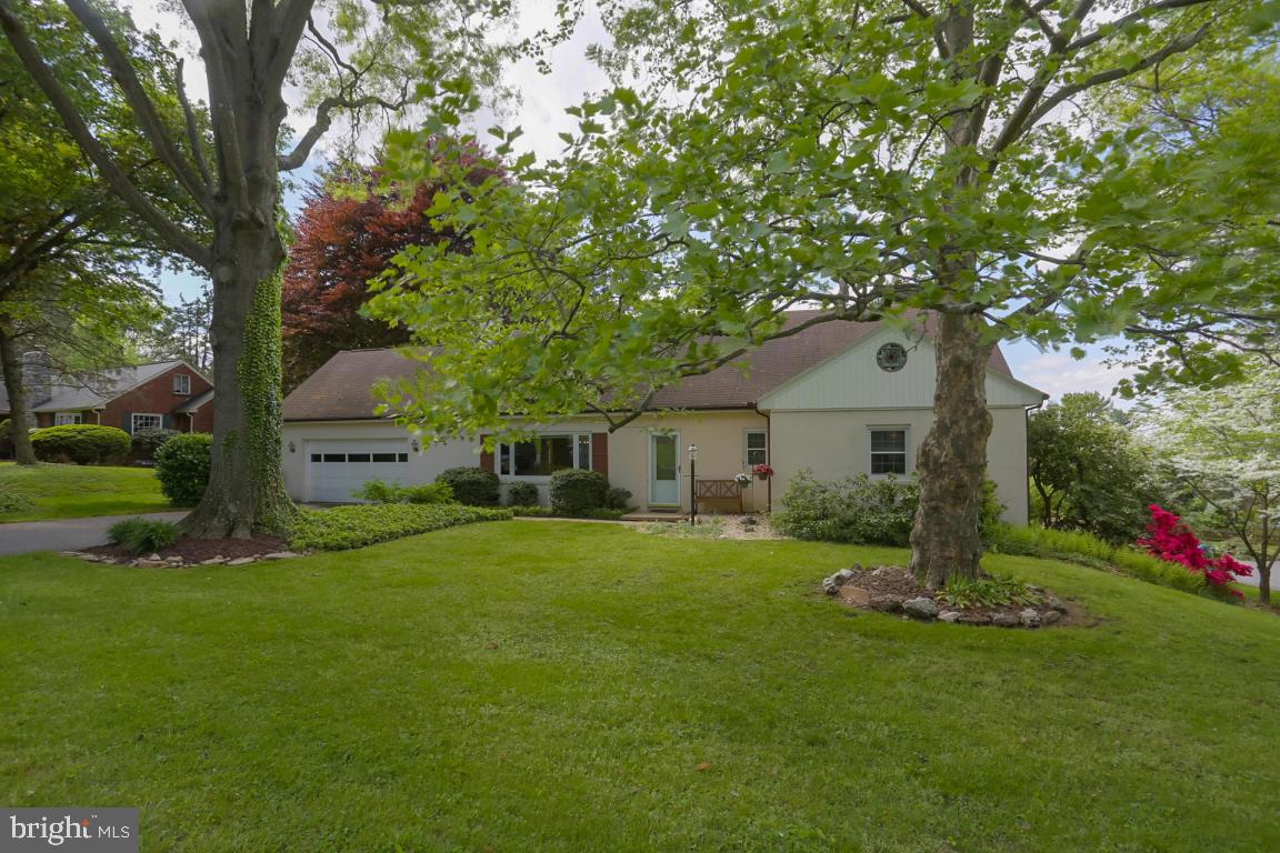 Desirable location with this 4 bedroom cape cod in Manheim Township's Blossom Hill with spacious living space. Lots of hardwood flooring, tons of storage including a walk in cedar closet and finished walk out lower level with workshop area. Bedroom suite with full bath on first floor, kitchen with breakfast bar, living room with wood burning fireplace and rear patio leads to spacious backyard with mature landscaping and shed.