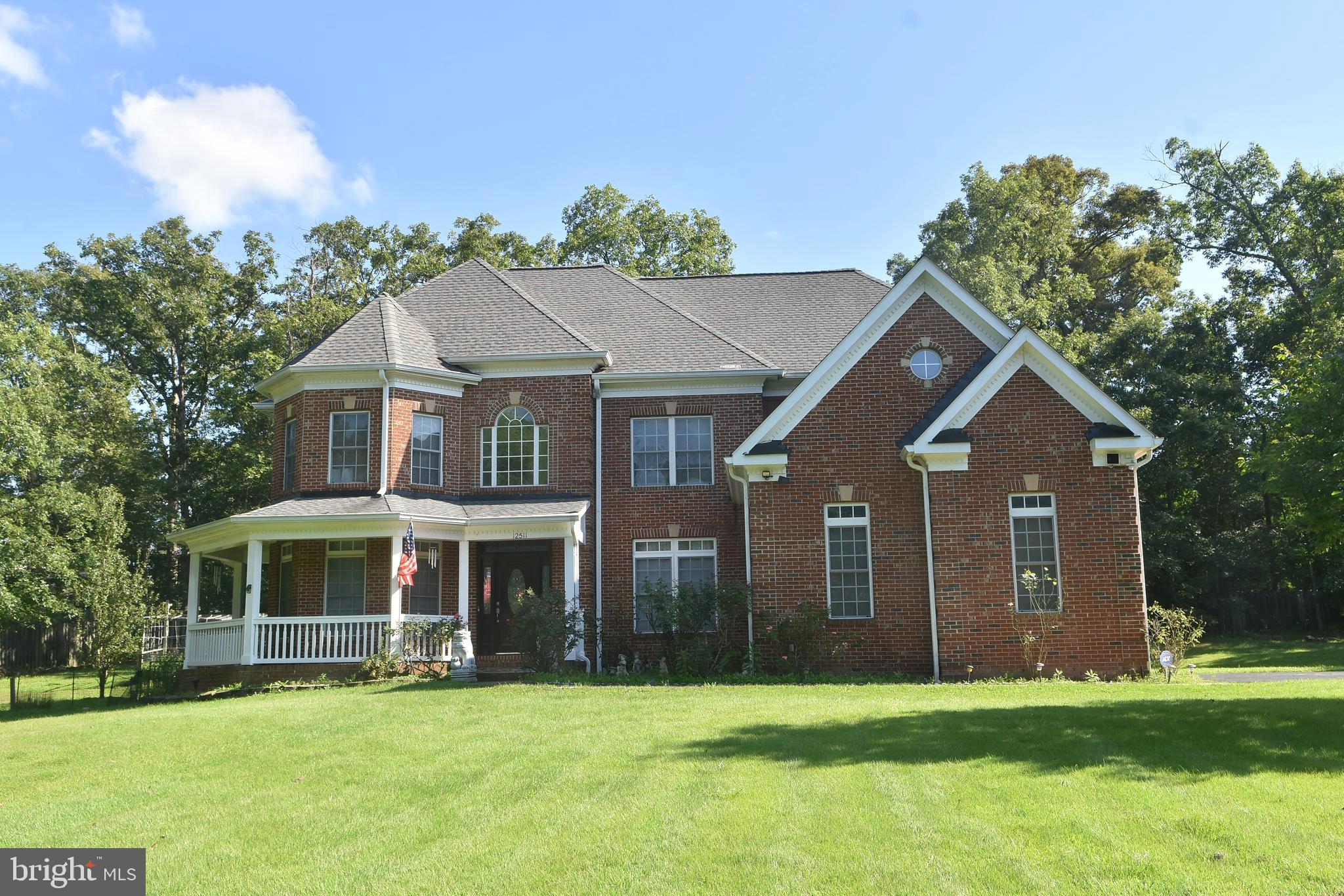 Great location!!! Custom Single Home with  3 car garage, 7 bedrooms and 5 full baths on the  1.1 acres lot.  This colonial style house has total finished 5,409 sqf. (Above finished is  3683. sqf, Below finished is 1726 sqf)
Step inside the main level  is soaring foyer ceiling with a gleaming chandelier and nice glossy hardwood floor throughout  the main level add warmth and character to the space, with elegant railings guides to upwards. 
On the left of main door is bright living area, and the lovely dinning area is on the right. The warmth and spacious family area has high ceiling with the cozy stone fireplace at the end.  There is a bright office room on the left that has door to the convenient full bath.  Nice Kitchen with wet bar featuring a sink, granite counter, and cabinets provides a convenient refreshment station. The bright eat-in area near to large windows and exercise room that lead to the huge wooden deck and the back yard.  Note: New roof in year 2021, New AC for upper level in year 2021.
Four nice and bright bedrooms with carpet floor and 3 full baths.  nice Zaccuzi in master bathroom.  There are a  walk -in closet , sitting room near to master bath on the upper level for added convenience. 
The finished basement expands the living and entertainment options, enjoy movie nights or game days in spacious area. with  3 bedrooms and full bath. this basement has walk -up on the right side to the garden.
The 3 car garage on the left side has door to the kitchen area. There is  anadditional water well for watering the lawn & garden.
This prestigious address  places you within a friendly neighborhood, perfect for raising a family or enjoying a peaceful lifestyle. The surrounding location of Fairfax offers easy access to top-rated schools, an abundance of shopping and dinning options, and commuter routes for exploring all benefits of vibrant community.