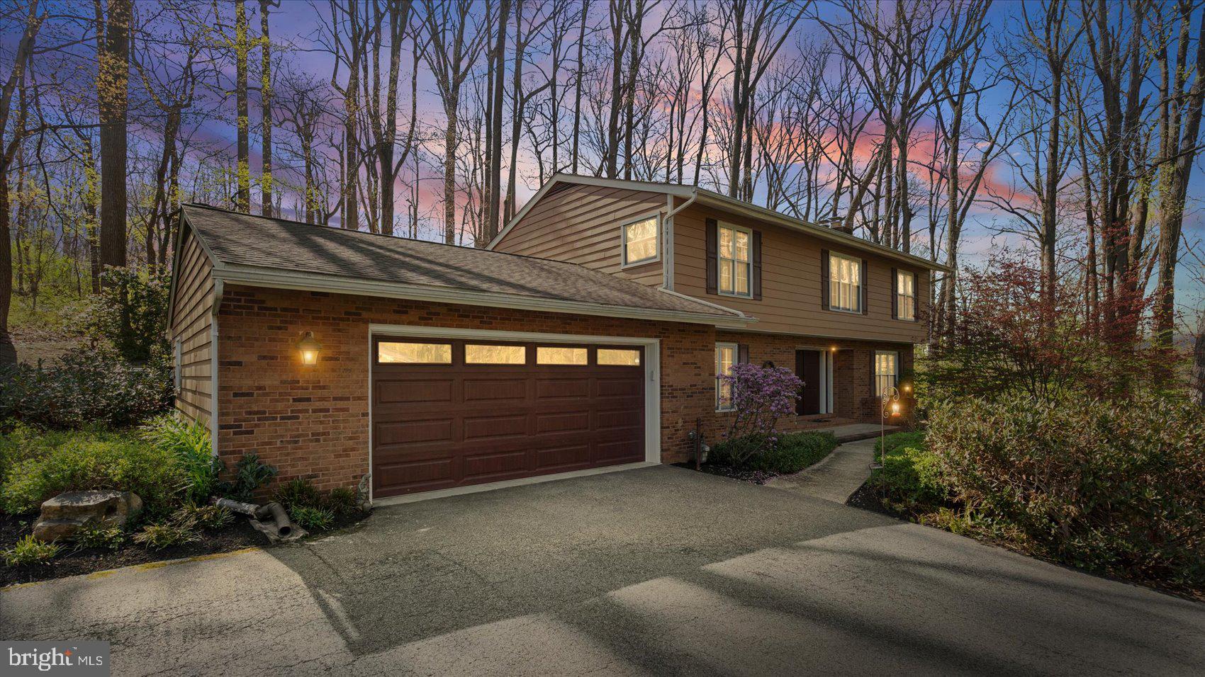 The perfect escape awaits. Discover the best of both worlds—peaceful, scenic living just steps from Loch Raven Reservoir, with easy access to Towson and major commuter routes. This stunning 4-bedroom, 3.5-bath Colonial blends timeless charm with modern updates, offering a lifestyle that feels like a retreat every single day. 

From the moment you step inside, you’ll notice the refined finishes, quality craftsmanship, and seamless flow from room to room. At the heart of the home, the Chef’s Kitchen and living room create an inviting gathering space—perfect for everything from casual mornings to lively celebrations. The Jenn-Air gas stove is top of the line, along with high end appliances. The dining room offers generous seating for hosting, and the sliding glass doors open directly to an expansive multi-tiered deck overlooking beautifully landscaped gardens—an ideal setting for indoor-outdoor living. The enormous second living room is a perfect space for congregating. 

What truly sets this property apart is its unique hillside setting. Rather than a traditional flat yard, the backyard rises into a wooded landscape - creating a sense of seclusion, scenic views, and a connection to nature that's hard to find. With the right vision, the outdoor space can be transformed into a series of terraced living areas, a private path to the top, or an elevated deck overlooking the trees. Enjoy the benefits of no rear development, added privacy, and a low-maintenance natural backdrop, all while being just minutes from everyday conveniences. 

Convenience meets style on the main level with a powder room, laundry room, and easy access to the attached two-car garage with ample work space.

Upstairs, the Primary Suite is a true sanctuary with brand new carpet. Privately set apart from the additional bedrooms, it features a spacious dressing area with mirrored walls and abundant closet space, leading into a serene bedroom retreat with room for a sitting area. The spa-like primary bath includes a separate glass-enclosed shower for a refined, relaxing experience. Three additional bedrooms and one additional bathroom complete the upper level.

The lower level offers incredible versatility—perfect for movie nights, music, or a quiet retreat—and has even served as a fifth bedroom. With a second wood-burning fireplace and a full bath, this space is as functional as it is inviting. An unfinished area provides a workshop and expansive storage.

This house is not just a home, it is part of a community! Windemere is not just a neighborhood, it is a place where neighbors are friends, front porches are living rooms and the community comes together to support each other. There is a yearly block party, seasonal celebrations and a dog walking circuit.  Food truck Wednesdays bring people from the neighborhood and surrounding areas to the Long Green Volunteer Fire Company for great food and laughs. 

This exceptional home delivers the lifestyle you’ve been searching for: tranquil surroundings, thoughtful design, community environment, ample privacy, and close proximity to shopping, dining, the reservoir, top-rated schools, and major roadways.

A few dates to note: Primary Bedroom and Third Bedroom Carpet (2026), Miele Dishwasher (2025), Water Heater (2024), Garage Door System (2022), Floors (first floor 2021), Roof (2020), Attic Insulation (2020), Washer (2019), Kitchen Countertops (2019), Kitchen Backsplash (2019), Garage Door (2018), HVAC (2018), JennAir Stove and Hood (2018), Well Tank (2018) and more.

A truly special opportunity you won’t want to miss.