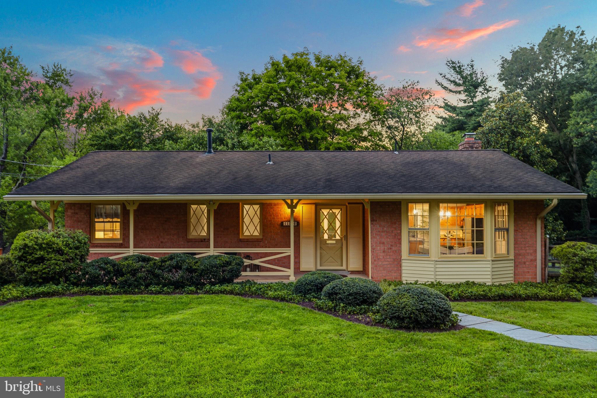 Welcome home to 11906 Renwood Lane, a beautifully updated brick rambler in the highly sought-after Tilden Woods neighborhood. Combining classic charm with tasteful modern updates, this move-in-ready residence offers an ideal blend of comfort, style, and functional space.
Step inside to a sun-filled main level featuring solid red oak hardwoods, fresh designer paint, luxury LVP flooring, and updated light fixtures throughout. The heart of the home is the updated kitchen, complete with sleek granite countertops, stainless steel appliances, and a charming breakfast area framed by a dramatic bay window that fills the space with natural light.
Designed for both comfortable living and effortless entertaining, the spacious living and dining areas flow seamlessly into a refreshed screened porch and an expansive rear deck. Overlooking an exceptionally private backyard, this peaceful outdoor retreat also includes a convenient built-in storage shed tucked beneath the screened porch, providing abundant space for lawn equipment, seasonal items, and outdoor gear. Three generously sized bedrooms and two updated full baths complete the main level. Downstairs, an expansive family room with a classic wood-burning fireplace and custom built-ins creates a warm and inviting gathering space. A fourth bedroom, full bath, and generous storage provide the flexibility to accommodate guests, a home office, or a private retreat.
Situated just minutes from Cabin John Village, Pike & Rose, Metro access, and I-270/495, residents will enjoy effortless commuting and quick access to premier dining, boutique shopping, and vibrant entertainment options. Impeccably maintained, freshly updated, and ready for you to move right in!