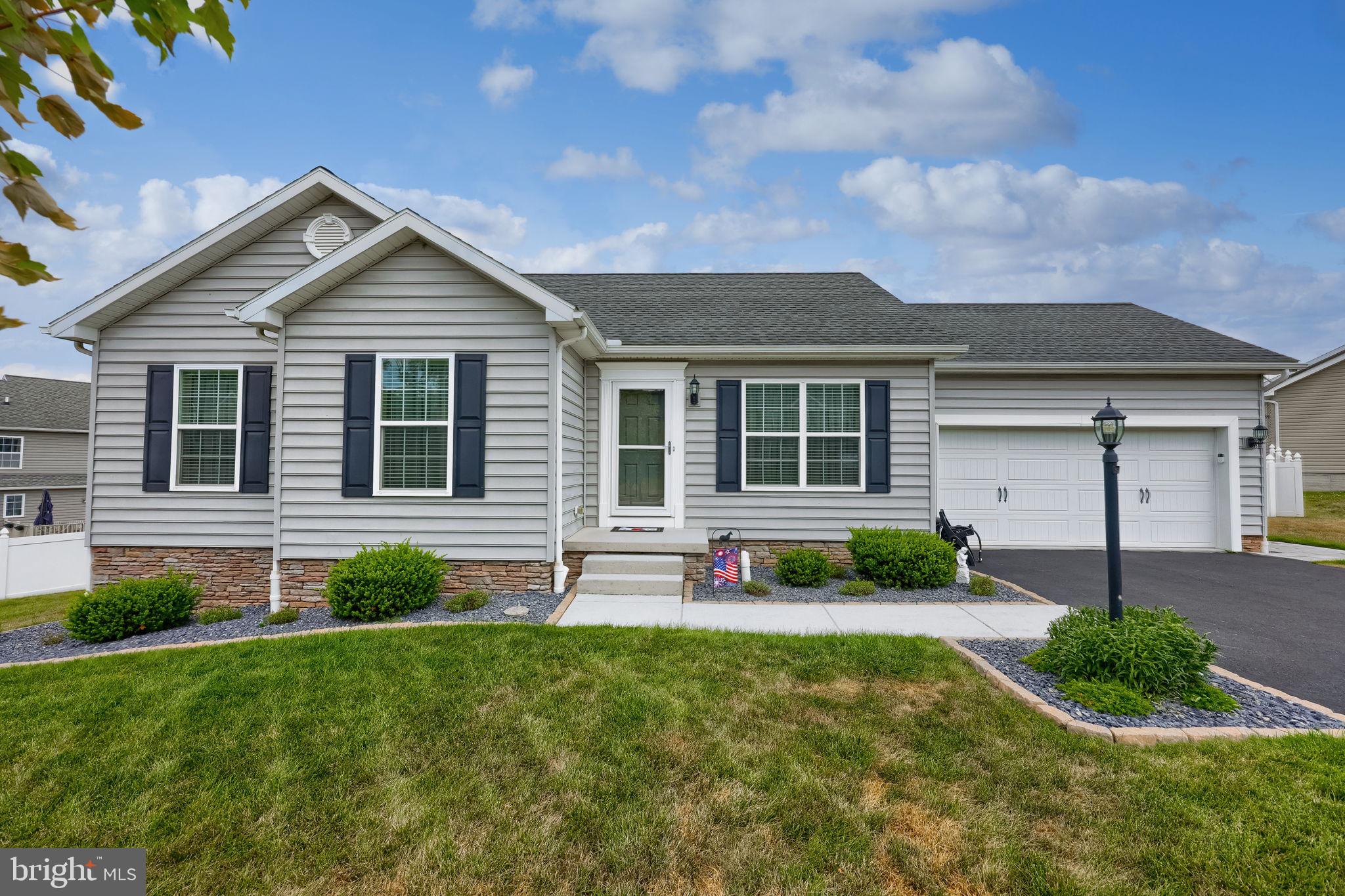 Enjoy low-maintenance living in this move-in ready one-story home featuring a bright and open layout with luxury vinyl plank flooring throughout. The spacious living room flows seamlessly into the kitchen and dining area, creating an ideal space for everyday living and entertaining. The kitchen is equipped with granite countertops, stainless steel appliances, and a dining area with direct access to the rear deck featuring maintenance-free decking. The main level includes three generously sized bedrooms, including a primary suite with a private en-suite bath. An additional full bathroom serves the secondary bedrooms, and a convenient main-level laundry area adds to the home’s functionality. Outside, enjoy a fenced backyard that provides space for pets, play, or relaxing outdoors. The unfinished lower level offers excellent potential for future living space and includes a brand-new 100-amp subpanel. Conveniently located with easy access to Rt. 30 and I-83, this home is just minutes from shopping, restaurants, and everyday amenities. Don’t miss this opportunity to own a well-maintained home in a desirable location!