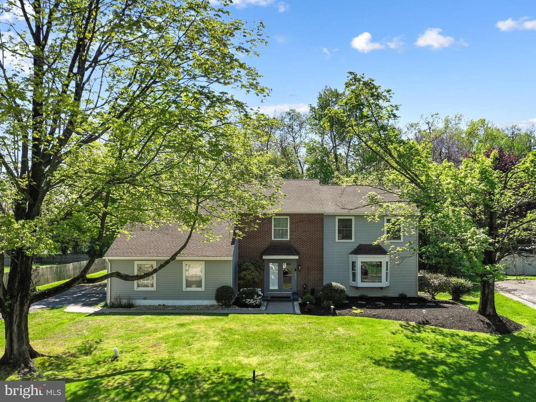Welcome to 1273 Quarry Commons Drive in beautiful Lower Makefield Township and the award-winning Pennsbury School District. This Pebble Creek home is back on the market after valuable renovations including removal of all stucco (for buyers' peace of mind), installation of new vinyl siding, new fascia board, new gutters and downspouts, repaired chimney, capping of all windows and doors, brand new plush carpet throughout the main staircase and 2nd floor, repainting of 3 bedrooms and primary bath, and more!  Best yet, spring has sprung so the backyard oasis is lush and green with the pool open and ready for action. Come back and take another peek - this home is all about space, both inside and out. If you are looking for an abundance of living space and generously sized rooms, it offers over 4,000 sq.ft.  (not including the unfinished basement ready for your future finishes) and a half acre lot backing to tranquil wooded open space creating a peaceful retreat with natural views year-round. The 1st floor features a 2-story foyer with elegant curved staircase, great open floor plan between the cozy family room with fireplace, large center island kitchen and fantastic solarium with wet bar and fireplace. Spacious formal dining and living rooms are ready for your large gatherings of friends and family. This home truly provides the ideal setting for seamless indoor/outdoor entertaining. When guests aren't hanging around the kitchen island and bar, they will be swimming in the pool or lounging on the deck and patio. A laundry/mud room and half bath complete the 1st floor.  Follow the main staircase to 4 bedrooms and 3 full baths. The primary bedroom is 29' X 14' half vaulted space that boasts a sitting area, gas-fueled fireplace, gorgeous view of the private backyard, walk-in closet, ensuite bath with dual vanity, jetted tub and shower. Bedroom #2 and 3 offer walk-in closets and share a full bath with dual vanity and tub/shower. Bedroom #4 is a second primary bedroom with terrific closet space and ensuite full bath. Looking for an additional recreation area?  Finish the basement with your own personal touches to create a fun game room (billiard, ping pong and air hockey tables included in sale) or take advantage of fabulous storage. Recent updates include new roof (2024), new luxury vinyl plank flooring in 2021, first floor professionally painted (2024), new sidewalk and landscaping (2025), brand new dishwasher (2026). Enjoy a quick walk or bike ride to Quarry Hill Elementary School, the Delaware Canal towpath and quaint downtown Yardley for great eateries, coffee, ice cream, shops and the Vault brewery. Two minute drive to Wegmans and 2 other grocery stores, restaurants and services. Easy commuting to Philly, the Princeton corridor, King of Prussia and NYC via nearby I-295, Route 1, PA Turnpike and local trains.  Don't forget the Lower Makefield recreation center with library, 4 outdoor pools, Kids Kingdom playground, picnic pavilion, sports fields and courts. This home is a great value in a great neighborhood - make it your dream home!