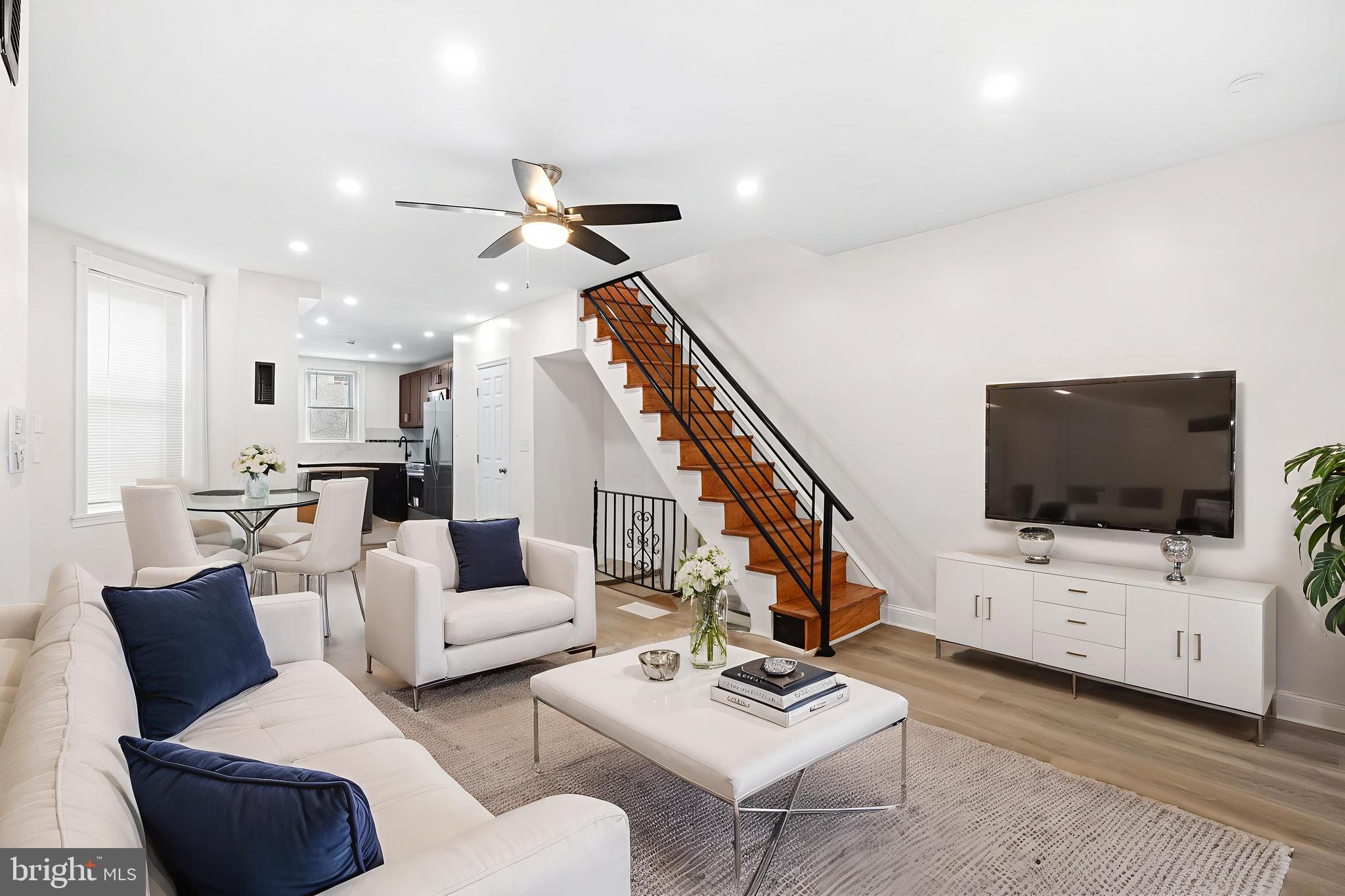 Located in the rapidly appreciating Kingsessing neighborhood, this move-in-ready home on Regent Street is ideal for first-time home buyers or new investors seeking rental returns. Kingsessing is celebrated for its rich history, vibrant community, and promising future. This home features 3 bedrooms, 2 bathrooms, a finished basement, and a brand-new kitchen with a Trex deck. Perfect for immediate occupancy, this property offers grants and incentives for qualified first-time homeowners. Step inside to a separate enclosed porch, perfect for morning coffee or as a mudroom. The spacious living, kitchen, and dining areas boast freshly painted walls and new flooring. The brand-new kitchen is a chef's delight with stainless steel appliances, granite countertops, and ample cabinetry. The adjacent Trex deck is ideal for entertaining or relaxing outdoors. Upstairs, you'll find three bedrooms filled with natural light, modern fixtures, and elegant finishes. The primary bedroom features a large bay window overlooking the street. The full bathroom on this floor includes contemporary fixtures, a stylish vanity, and a relaxing bathtub. The finished basement offers additional living space, a second full bathroom, and a laundry room. This area is perfect for a future recreation room, home office, or other uses. All major systems have been recently updated, including a new air conditioner, heating system, roof, water heater, and windows. Conveniently located near public transportation and minutes away from universities, parks, shopping, dining, and museums, this home offers perfect urban convenience. It is within walking distance to Woodland Ave's eclectic shops and eateries and ICS West's excellent educational opportunities. The location is key, with a short distance to Center City, the Grays Ferry Bridge, Cobbs Creek Parkway, Pennovation, U-City, U-Sciences, CHOP, Drexel, and U-Penn. 
****Qualified first-time buyers may be eligible for up to $5,000 in local grant assistance toward closing costs making this home even more accessible! ***