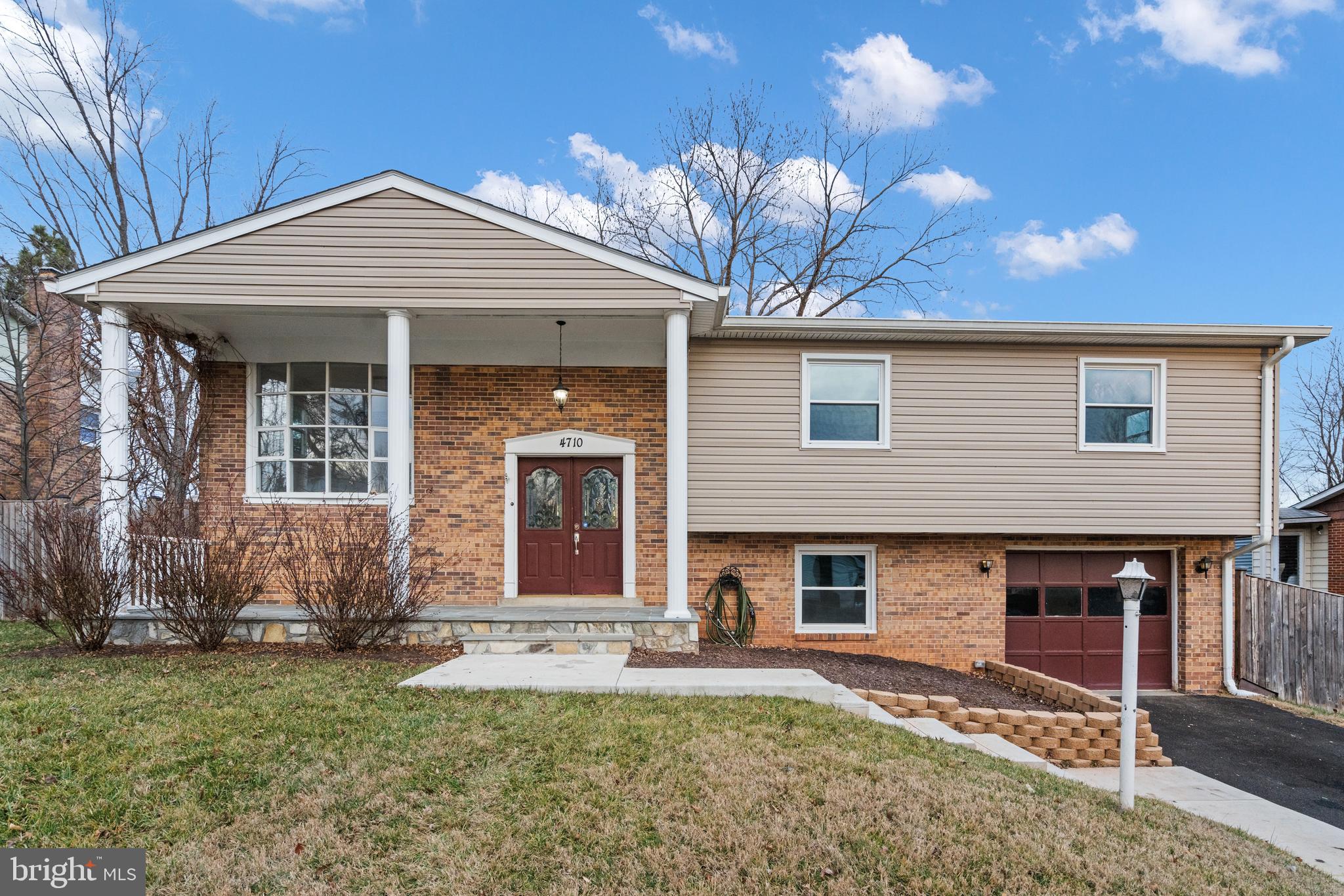 Welcome home to this renovated beauty in Dale City that you will just fall in love with! Move right in to this 2,200+ finished square foot home that boasts four bedrooms, two and a half bathrooms, a one car garage, and has been renovated top to bottom. In 2022, NEW 50 year roof with architectural shingles, siding, front porch, sidewalk, driveway. In 2021, NEW Pergo waterproof flooring on the main level. Some other recent improvements include: 18ft round above-ground pool in 2017, windows and 6 foot privacy fence in 2016, HVAC in 2015, and water heater in 2012. There are new light fixtures and finishes throughout the home. As you enter through the front double doors, you are greeted by the bright living room with its elegant trim, chair railing, ceiling fan, and casement windows. The nearby dining room continues the elegance with its trim work and chair railing but also includes a modern chandelier, and a picturesque front window. The dining room opens to the kitchen and the chef of the home will enjoy cooking here! Stainless steel appliances, granite countertops, plenty of cabinets, tile flooring, backsplash, and french doors that lead to the tiered deck. There are three bedrooms on the main level all with ceiling fans and ample closet space. The primary bathroom and the hall full bathroom have been renovated as well. Step on down to the fully finished basement. Here you will find the huge rec room, the fourth bedroom, half bathroom, and laundry room. Walkout in the fenced-in backyard from here for added convenience. The homeowners have enjoyed having a huge backyard to include swimming in their above-ground pool and letting their pets have tons of room to run and play. The homeowners will miss the quietness and friendliness of the neighborhood. No HOA and ready for you! Hurry, you don't want to miss this one!