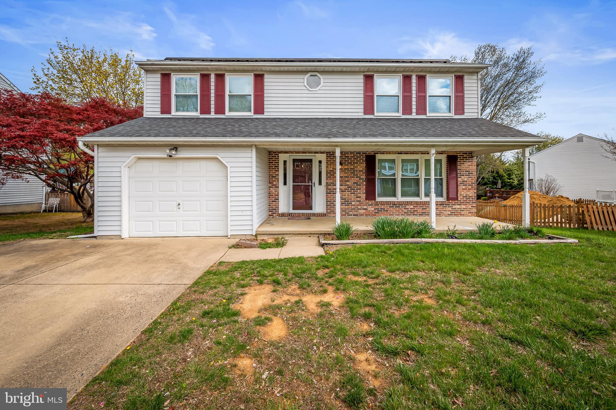 Welcome to 228 Heather Way in Bayview Estates—a charming, energy-efficient colonial perched in the hills above Havre de Grace with Chesapeake Bay views from the upstairs front windows. This spacious home features four large upper-level bedrooms, including a private primary suite with an updated bath and two closets. The main level features formal living and dining areas, an eat-in kitchen with a peninsula, a cozy family room with a wood-burning fireplace, and French doors that lead to a covered deck and a large, fenced yard—perfect for entertaining. The finished lower level features a spacious kids' playroom/family room, a half bath, laundry facilities, ample storage, and walk-out access to the yard. Enjoy summer evenings on the porch and year-round comfort thanks to major energy-saving upgrades, including a 2018 geothermal HVAC system and owned solar panels, which keep energy costs minimal. Recent improvements include a new stove (2022), windows (2015), and roof (2016), making this home move-in ready and cost-efficient for years to come. Virtual staging.