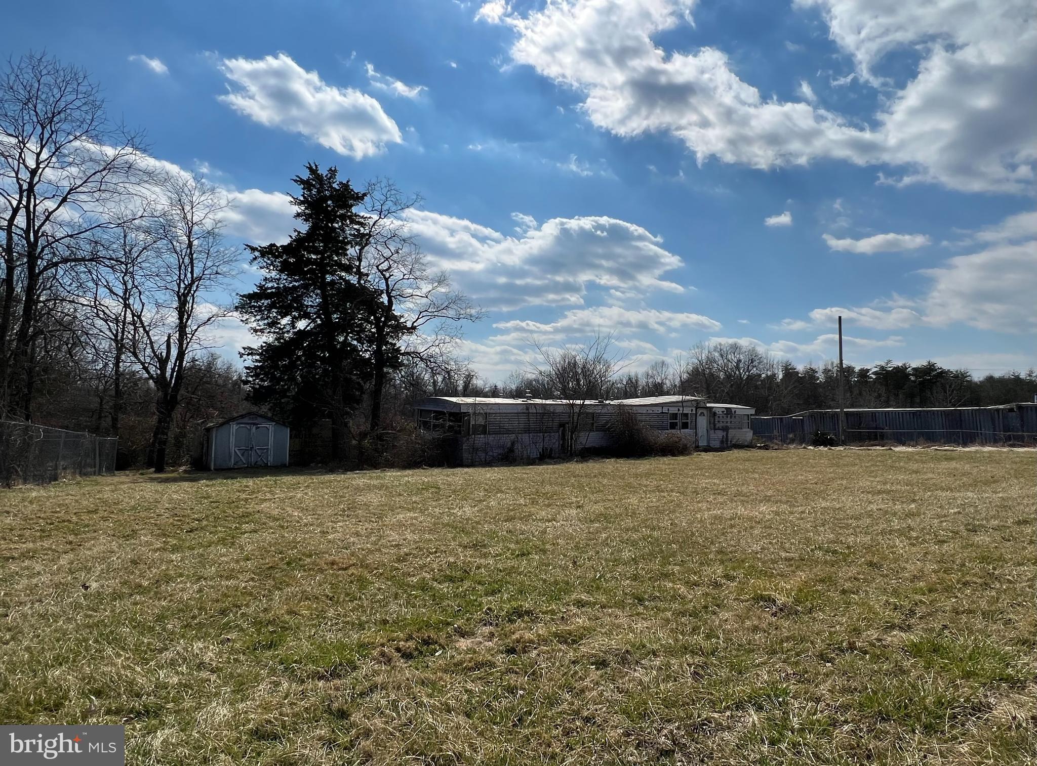 3.67 Acre Parcel with abandoned mobile home on the property with public water,  private septic and electricity.  All open land and there is a fence on property.  NO HOA!

There is a locked gate with a lockbox on it so please call to schedule an appointment to view the property with an agent.