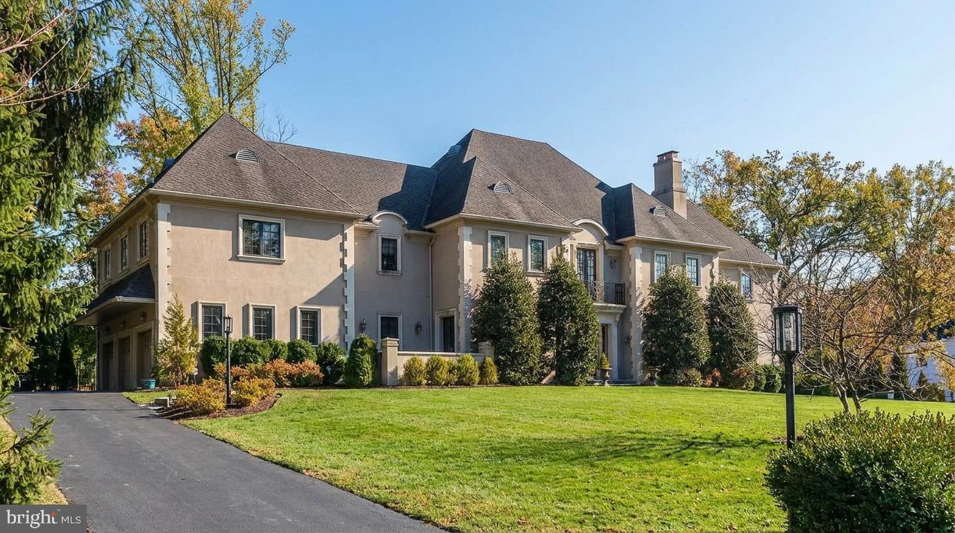 Memorial Day Weekend  Open House !!! North Bryn Mawr Custom-built Estate Manor Home—10,856 sq ft, of finished living space, 6+ bedrooms, 7 full baths, 2 half baths, private 3-floor mahogany paneled elevator. Step into the pinnacle of gracious living nestled on a serene cul-de-sac.
Built in 2008, & sparing no expense, updated & completed by the Sellers by 2011  this masterpiece seamlessly blends timeless elegance, exceptional craftsmanship & modern conveniences to create an extraordinary lifestyle for you, the discerning homeowner.
From the moment you enter, the soaring 10-foot ceiling, striking oak staircase & landing & elegant wrought iron rail set the tone for the grandeur.

Take an immediate left from the foyer into the pale blue, coffered ceiling French doored, double chandeliered large formal dining room where your Thanksgiving will have a Presidential feel. Connect to the heart of your home into a double rounded arch ceiling, made for entertaining black & gold Butler Pantry with Sub-Zero wine chiller, granite countertops, and  storage including glass pane cabinets to an continuous coffered ceilinged open floorplan of Kitchen, curved wall of windows Informal Dining Area & French Door to Patio, windowed Family Room, all w/ 5 inch wide plank oak floors, exquisitely stained.

The heart of your abode begins with a dream gourmet kitchen, centered around a stunning expansive 9 x 4 ft granite counter island. Custom cabinetry, stainless steel appliances, and a spacious pantry  - functional meets beauty. Perfect for everything from casual breakfasts to lavish dinner parties, the adjacent dining area is a sunlit haven with windows overlooking the picturesque rear landscaped grounds. Step outside through glass-paneled doors to discover flagstone walkways, lush landscaping, and a hidden garden that offers a peaceful, private retreat. The open space is completed by the ceiling to floor stone gas burning  fire place, Family Room which serves as a welcoming yet elevated meeting space.

The formal living room to the right of your foyer invites you to relax in refined comfort with its marble-surround wood burning fireplace and eight-foot French doors. Five-inch oak floors with intricate inlays further enhance the warm sophistication. Specialty wood floors set a theme for the rest of the first floor with a herring boned floor chess room. You also have 2 powder rooms an office/bedroom and green reading room. Many private spaces for your great and private thoughts!

Upstairs, the master bedroom suite defines indulgence with 1,281 sq ft of serene luxury. The wide and long French door to balcony bedroom with ten-foot tray ceiling flows to a sitting room and his-and-her walk-in closets w/ classically outfitted furniture grade cabinets. The spectacular spa-inspired bathroom features a whirlpool tub, an oversized shower with six body sprays, a ceiling-mounted rain head, and steam functionality for the ultimate relaxation experience. Four additional bedrooms, each with ensuite private bath, provide comfort and privacy for family and guests. Two of the bedrooms have a single-entry foyer next to the elevator for an ideal in-law suite. One bedroom includes a loft, perfect for added flexibility. A large laundry room completes this level.

The finished lower level offers 2,502 finished sq ft.  Highlights - climate-controlled wine storage, bedroom with full bath, media room, gym, dance floor with sound control strobe light, large workshop with 2nd laundry &  store room, plus walk-out. The private elevator connects 3 levels, lower to main to bedroom floor.

The 4th floor, up a stairway from the bedroom floor has 812 sq ft of finished space with full bath, currently with 2 offices and bedroom. Also tons of unfinished storage.

Located in award-winning Lower Merion SD & just minutes to highly ranked Main Line Private Schools, top-tier shopping, dining, and culture 621 Great Springs Rd offers tranquility, luxury, and convenience.
