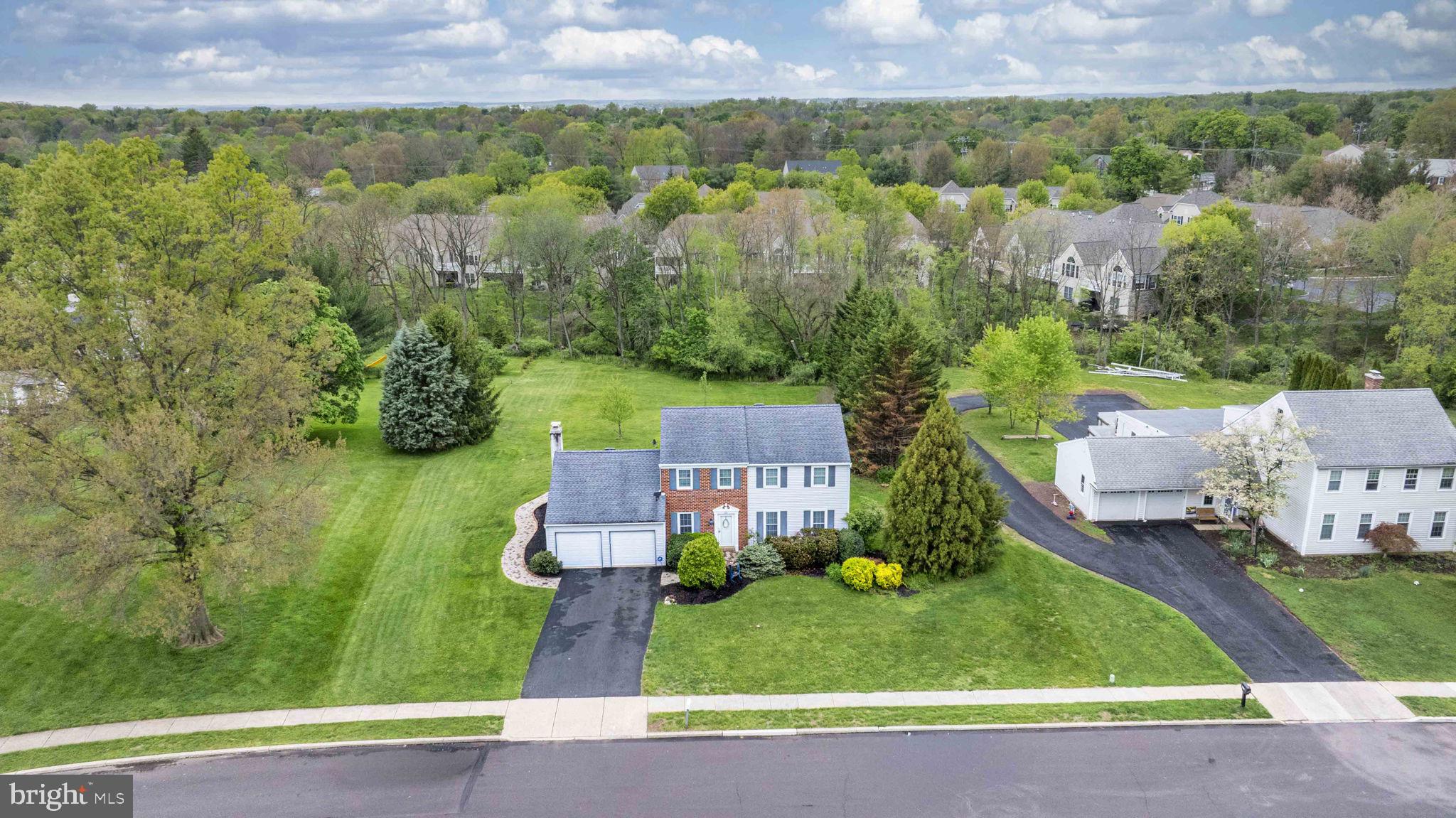 Welcome to 634 Conestoga Lane, a classic Betsy Ross colonial in Towamencin Township offering 2,266 square feet of well-planned living space on a .70-acre lot on a cul-de-sac street in Lansdale, PA.

A slate-floored foyer sets a polished tone and leads to a formal living room and a separate dining room enhanced by crown molding and chair rail. The custom kitchen features 42" cabinetry, granite counters, a double sink with gooseneck faucet, breakfast bar, recessed lighting, tile flooring, beautiful windows and double atrium doors that open directly to the backyard deck, creating a smooth indoor-outdoor flow.

Adjacent to the kitchen, the family room includes a brick wall with slate mantle fireplace and views of the rear grounds. A convenient powder room and access to the oversized two-car garage complete the main level.

Upstairs, you will find four well-proportioned bedrooms and two full bathrooms, including a hall bath and an en-suite bath in the main bedroom, providing flexibility for a variety of living arrangements.

Outdoors, the property offers a maintenance-free deck, a paver hardscape patio, and a large, flat backyard suitable for recreation, gardening, or entertaining. A large shed provides additional storage beyond the oversized garage.

Located in the North Penn School District and Towamencin Township with easy access to area roadways, shopping, and local services, this property combines a traditional colonial layout with practical updates and a generous homesite. This lovely property is  ready for its next owner.
