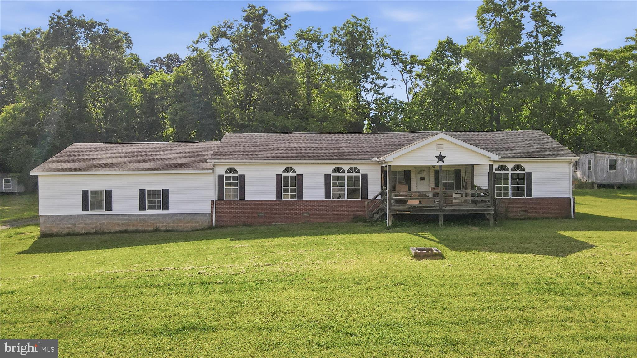 Opportunity awaits on this unrestricted 11.9+/- acre property in Hedgesville! Formerly used for livestock, the land offers plenty of space for horses, cattle, chickens, gardening, recreation, or simply enjoying country living without HOA restrictions.

The property features a 3-bedroom, 2-bath manufactured home with a spacious addition and attached 2-car garage area. The garage addition is unfinished, with a gravel floor and no garage doors currently installed. The home itself will require repairs and updates and is being sold strictly AS IS.

With nearly 12 acres of unrestricted land, multiple outbuildings (CHICKEN COOP, BUTCHER BARN and BARN! A layout well-suited for hobby farming or homesteading, this property offers tremendous potential for the right buyer. Whether you’re looking for a renovation project, investment opportunity, or a place to create your own rural retreat, this property is worth a look.

Inherited Property. Seller will make no repairs. Cash or conventional financing may be best suited due to property condition. Buyer responsible for verifying all information deemed important.
