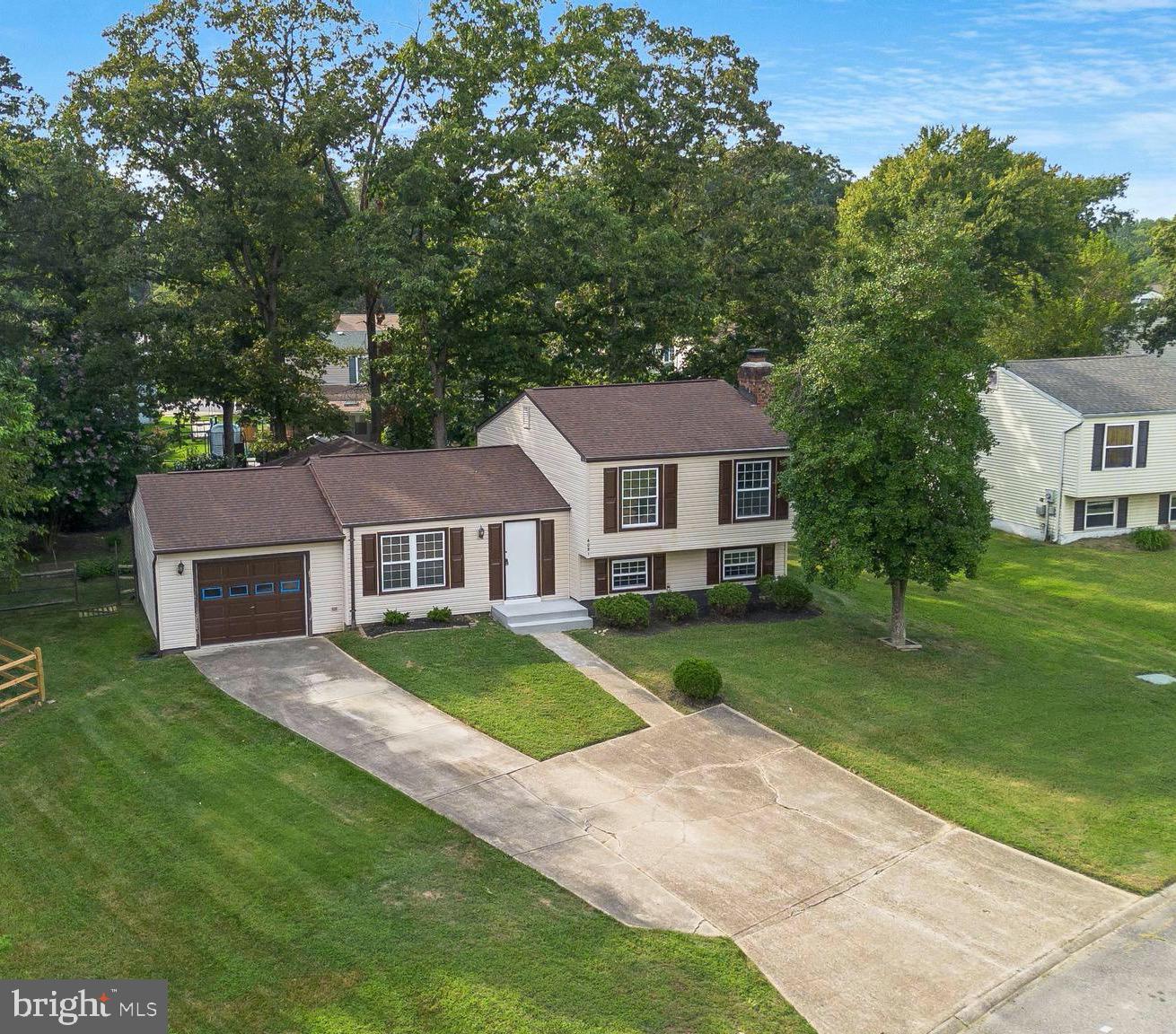 Sellers have just recently reduced the price for a quick settlement.  Welcome to this beautiful multi-level home with three finished floors. Recently renovated, it boasts a fresh and modern look with new vinyl plank flooring throughout, complemented by elegant hardwood on the main level. The kitchen has undergone a remarkable transformation with its remodel, now featuring brand new stainless steel appliances.

With three bedrooms and 1.5 baths, this home provides ample space for a family or individuals seeking room to grow. The main level is thoughtfully designed, with a large open concept encompassing the living room, dining area, and kitchen, creating an inviting and spacious ambiance. Additionally, the sunroom, adorned with ceramic flooring, extends from the kitchen and dining room, offering a cozy retreat bathed in natural light.

Practicality meets comfort on the lower level, which includes a generously sized recreation room highlighted by a charming brick fireplace. This floor also presents the opportunity for a den or an extra sitting/game room, catering to various lifestyle needs. Conveniently located on this level is the laundry area, ensuring effortless daily chores.

Situated in a prime location, this home enjoys proximity to schools and shopping, making daily errands a breeze. Embrace the comfort, style, and practicality of this thoughtfully updated home, ready to provide you with a delightful living experience.